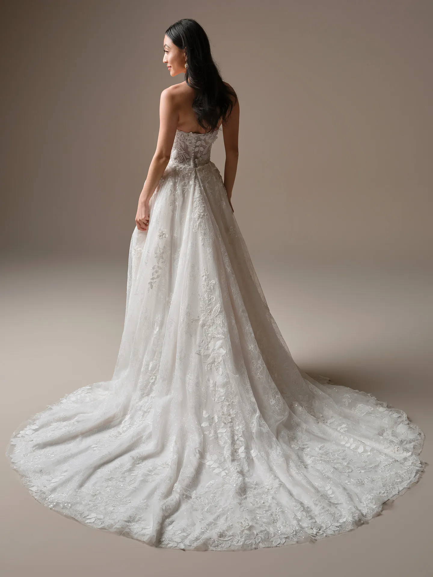 Laurie, back view floral lace fit-and-flare wedding dress Maggie Sottero.