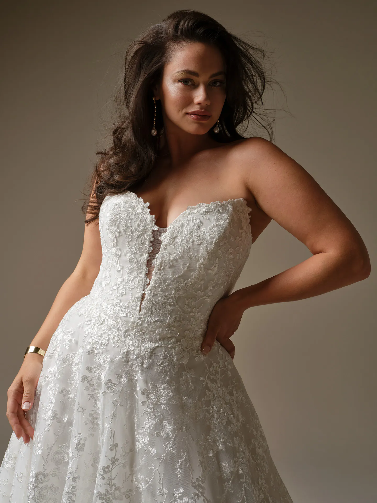 Maggie Sottero Memphis, front view lace A-line wedding dress with plunging neckline.