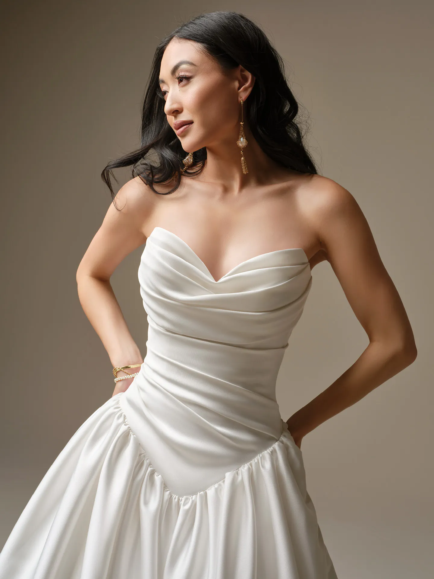 Maggie Sottero Pasadena, front view ballgown features draped bodice and basque waist.