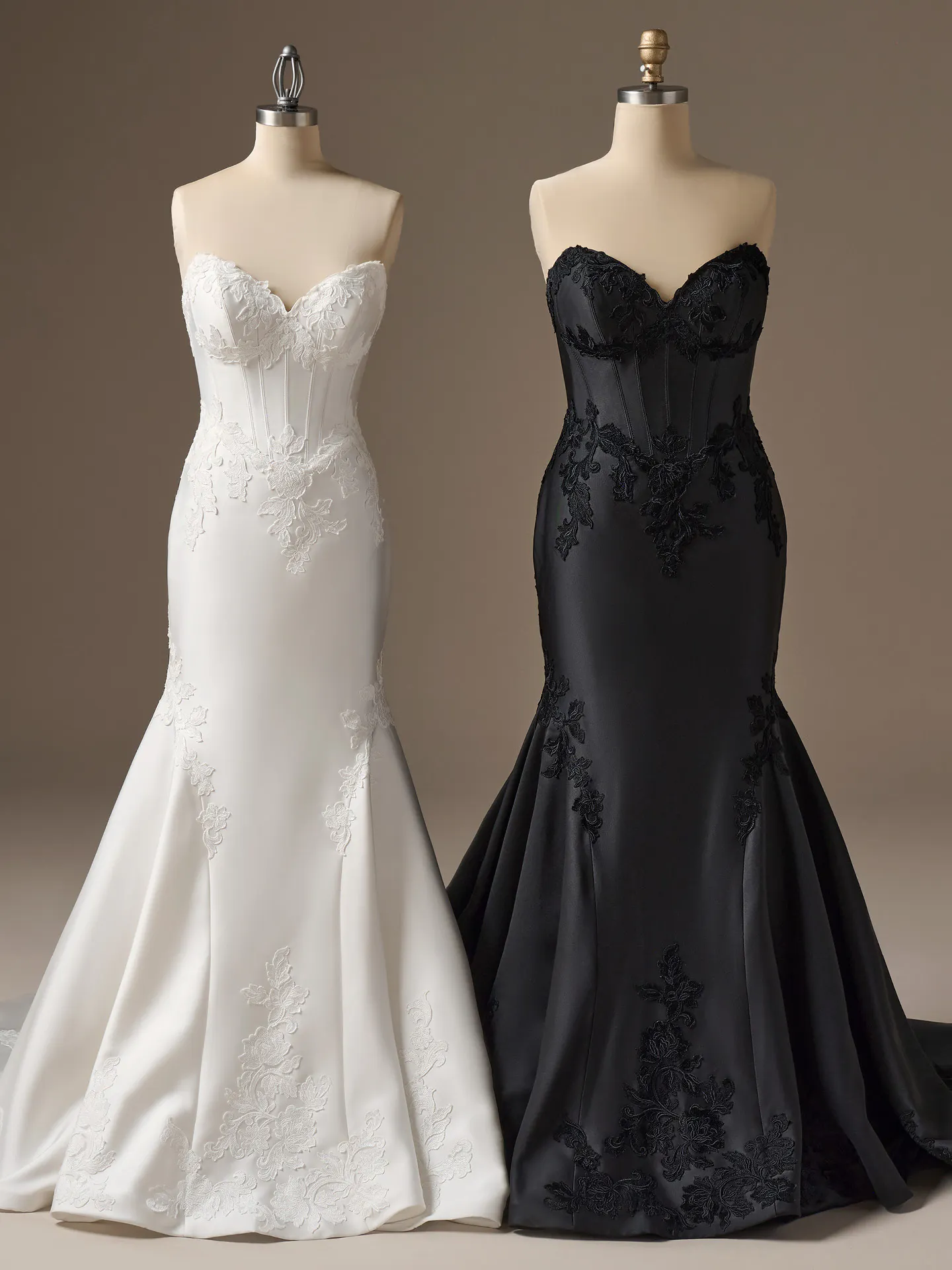 Rebecca Ingram Serafina black and white strapless gowns on mannequins, front view.