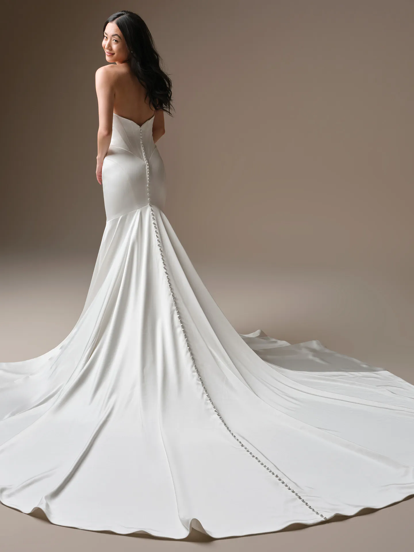 Maggie Sottero Sinclaire, back view, cat eye sheath wedding dress with long train.