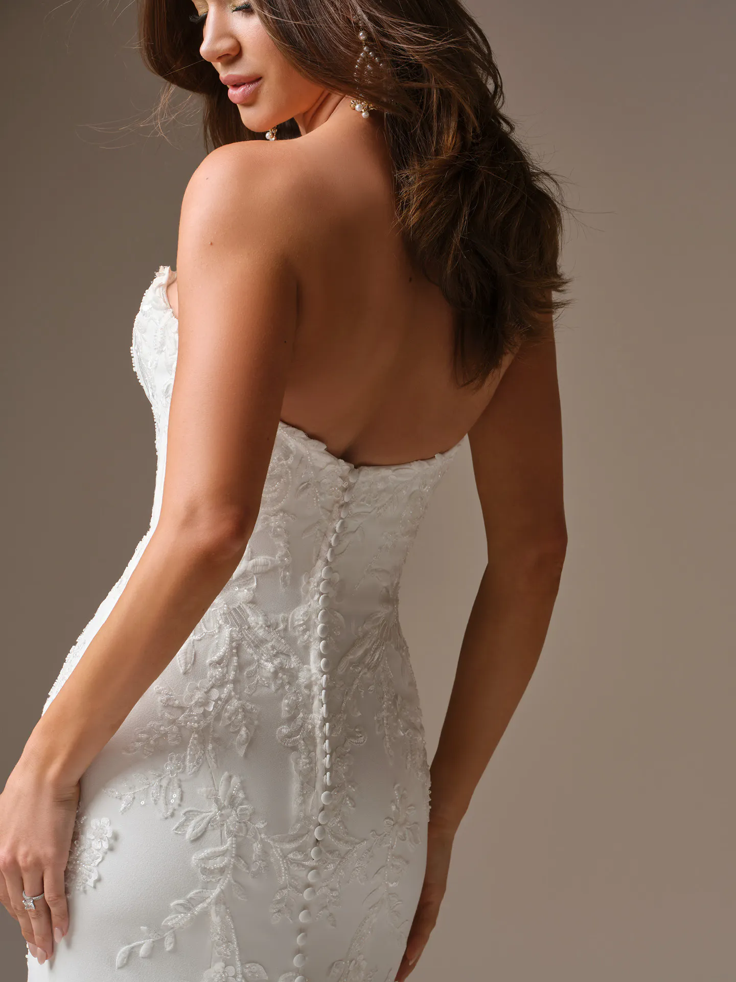 Maggie Sottero Thera fit-and-flare wedding dress back view by Maggie Sottero.