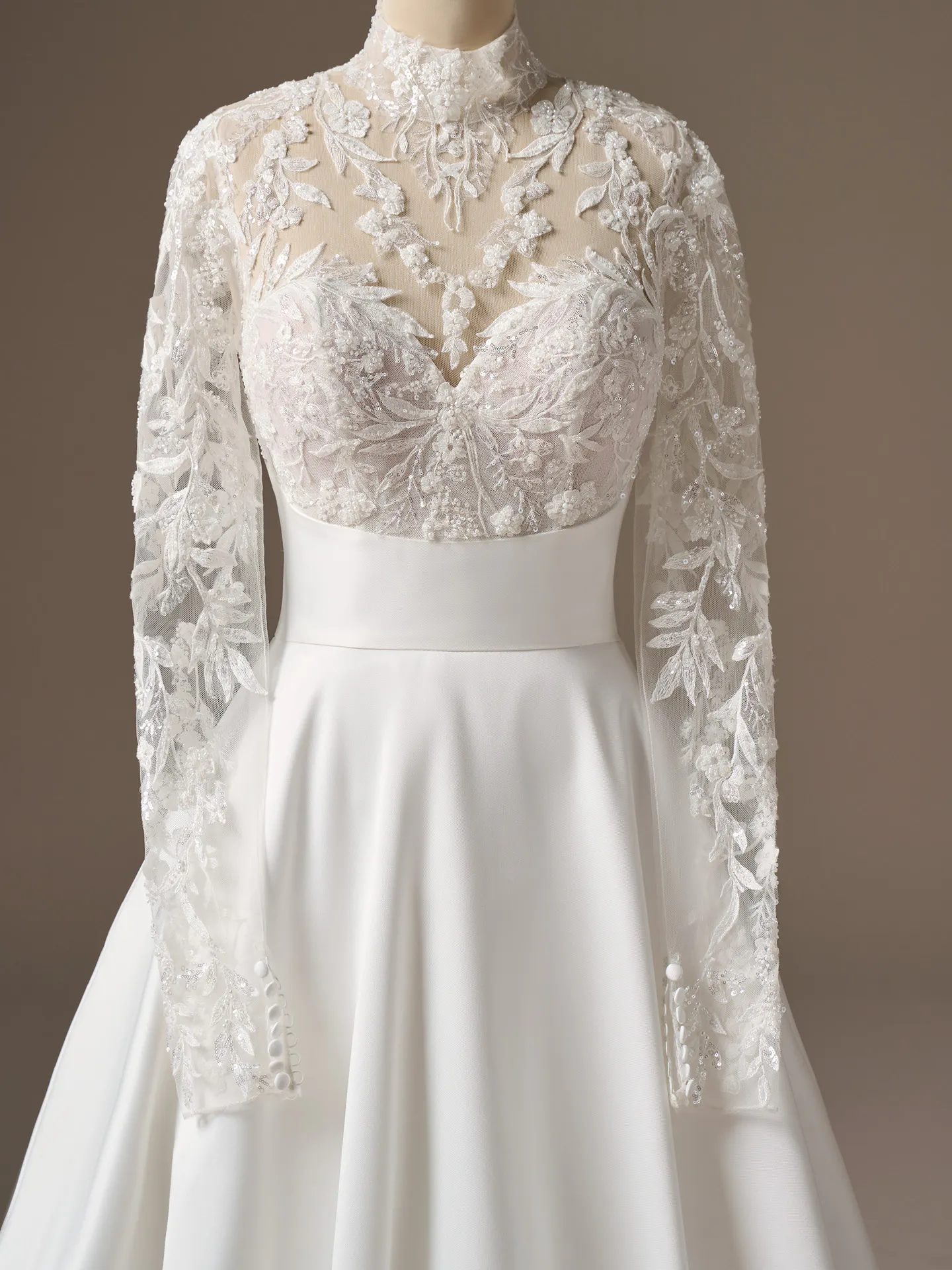 Maggie Sottero Trinity mock neck A-line wedding dress front view lace sleeves Maggie Sottero.