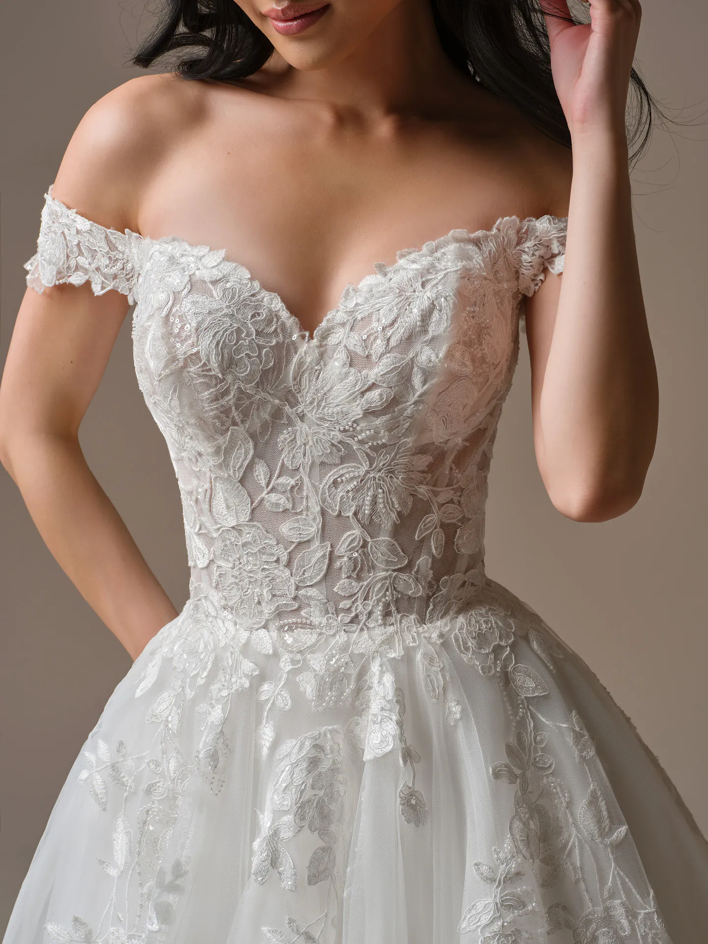 Maggie Sottero Verina off-shoulder lace A-line wedding dress front view.