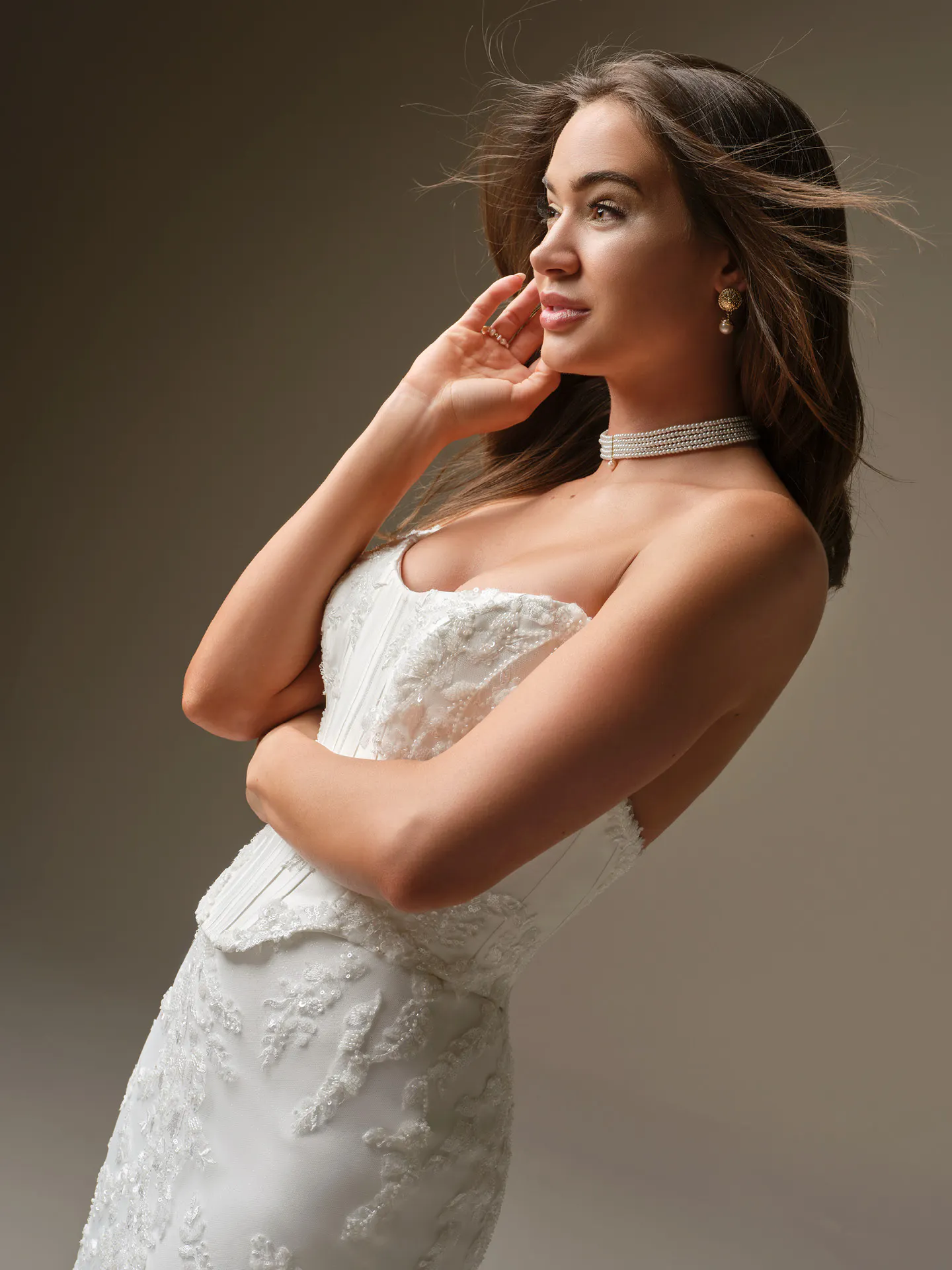 Maggie Sottero Wyntelle fit-and-flare lace dress, side view Maggie Sottero.