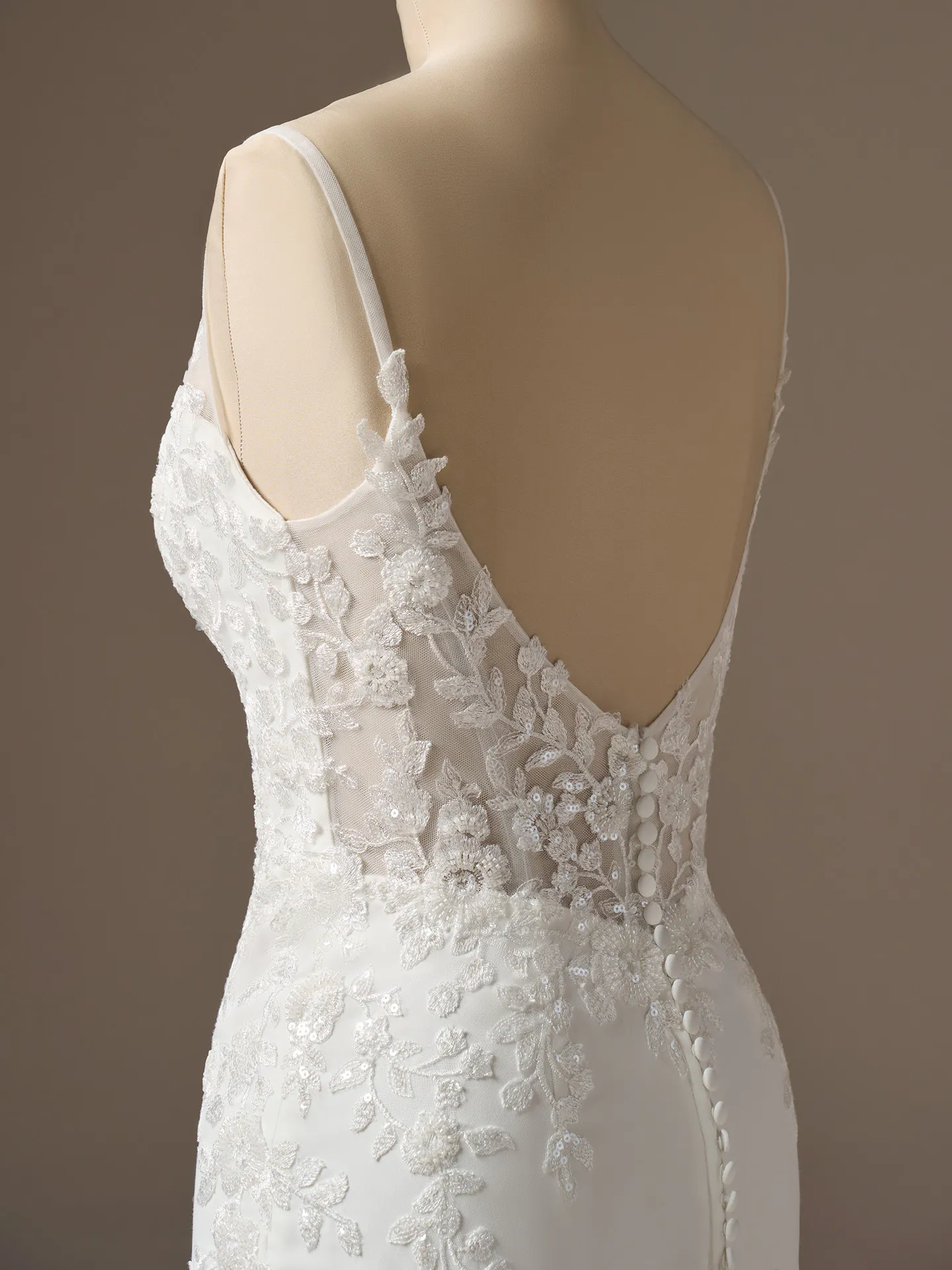 Rebecca Ingram Holly back view, lace details, illusion deep V-neck sheath wedding dress