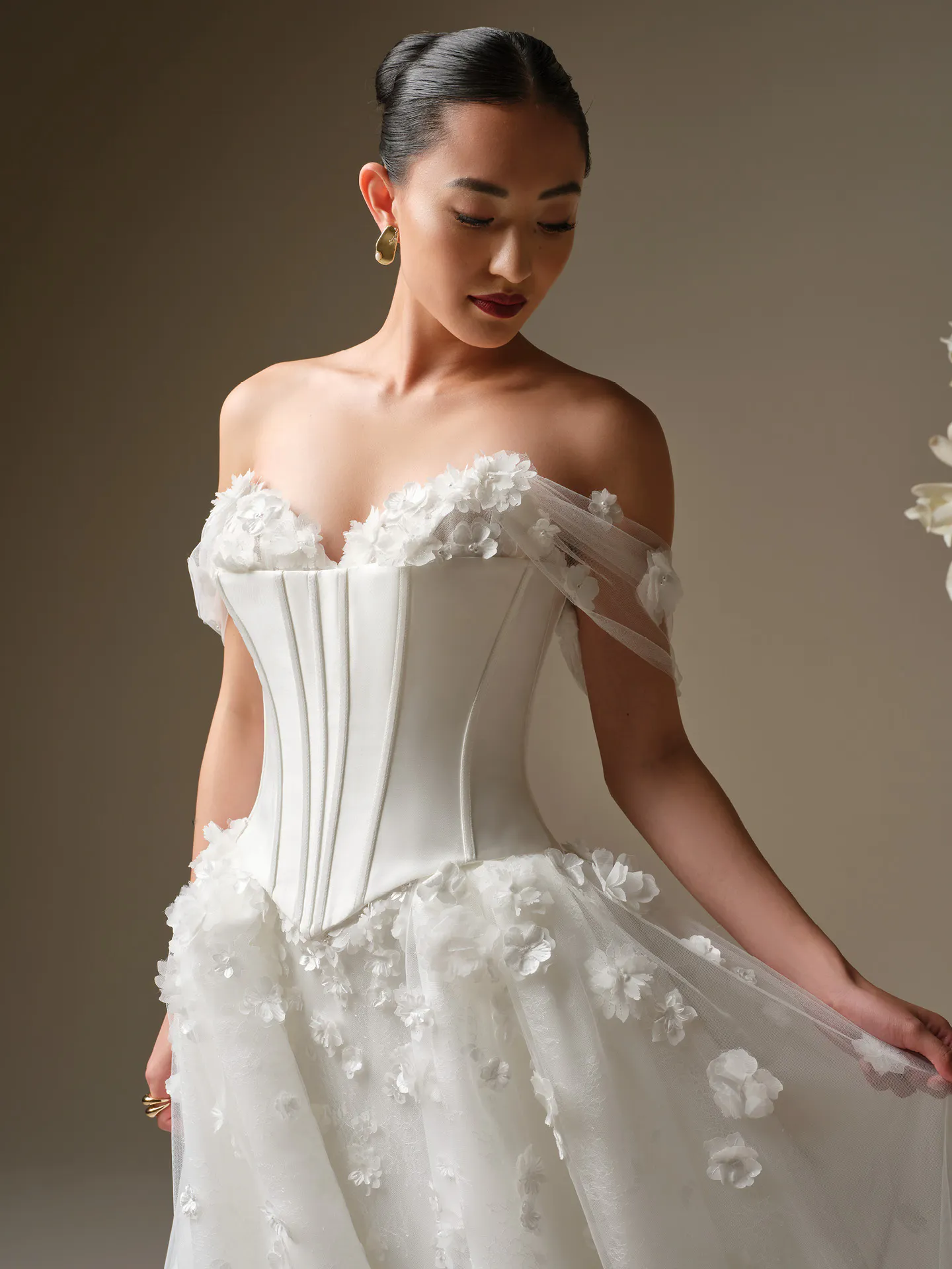 Maggie Sottero Akari 3-D Flower Fit-and-Flare, front view.