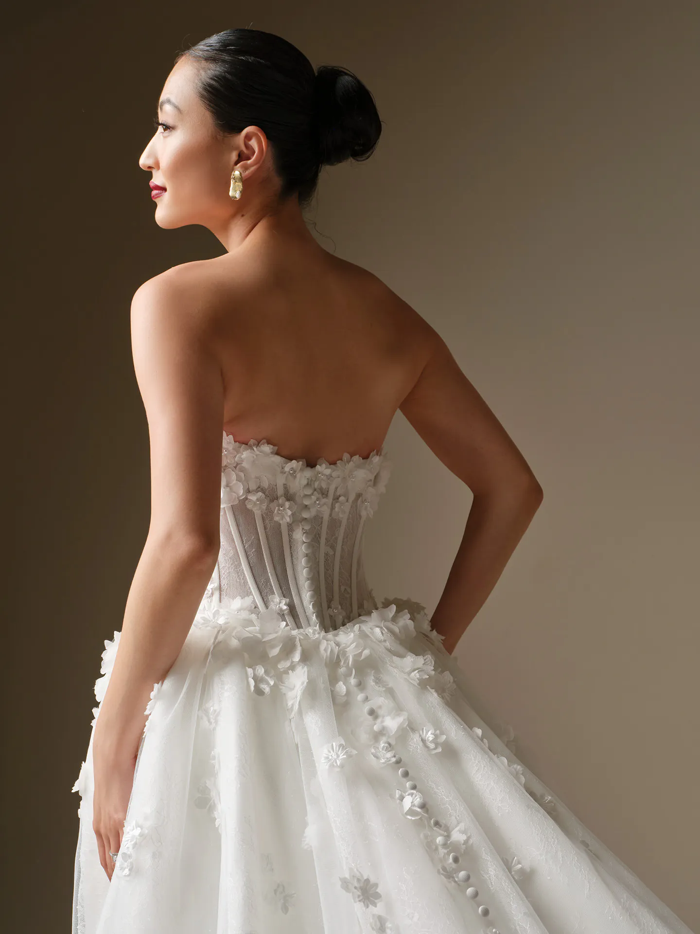Maggie Sottero Akari, back view 3D flower fit-and-flare wedding dress.