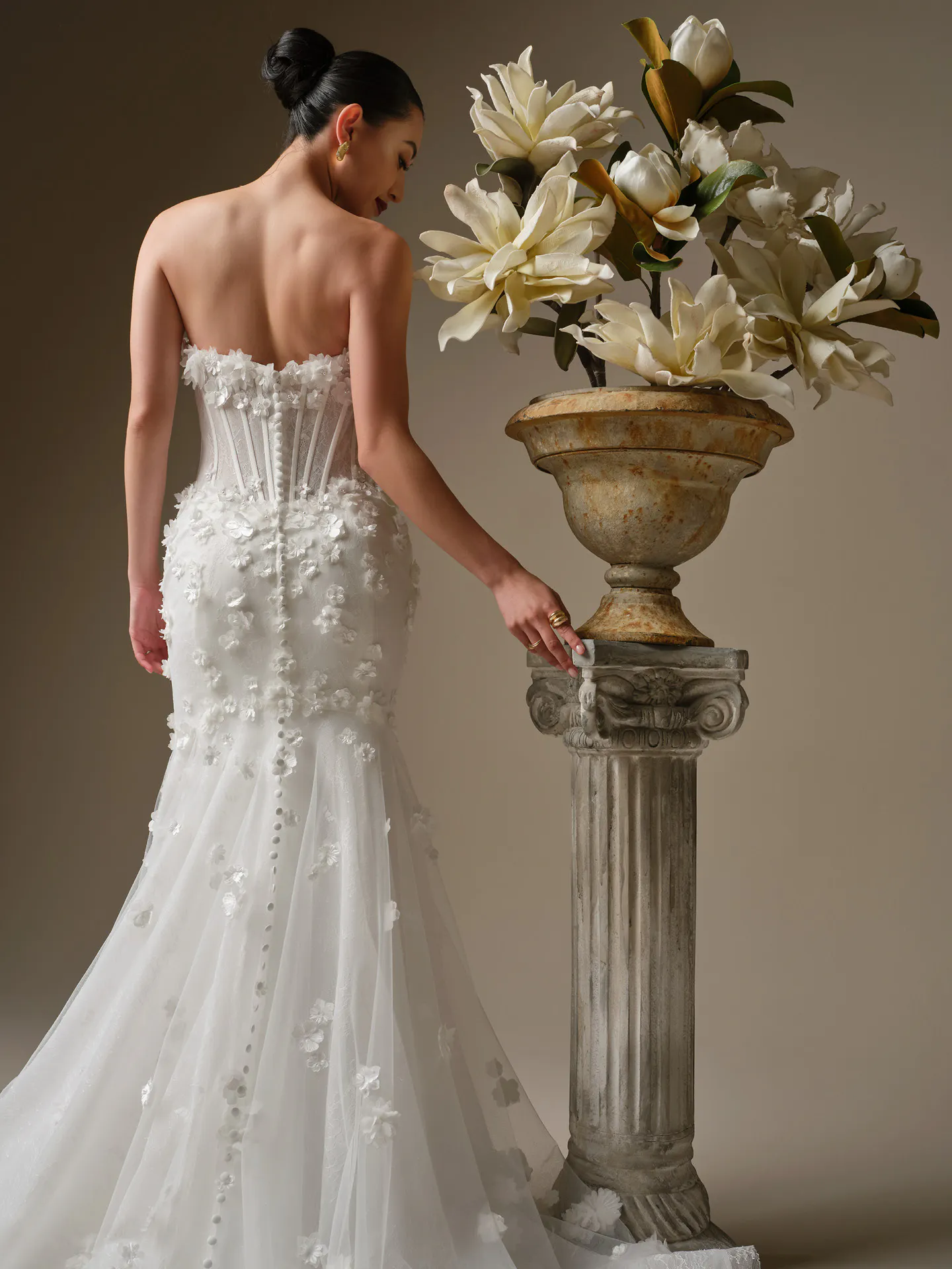 Maggie Sottero Akari, back view, 3-D flower fit-and-flare wedding dress.