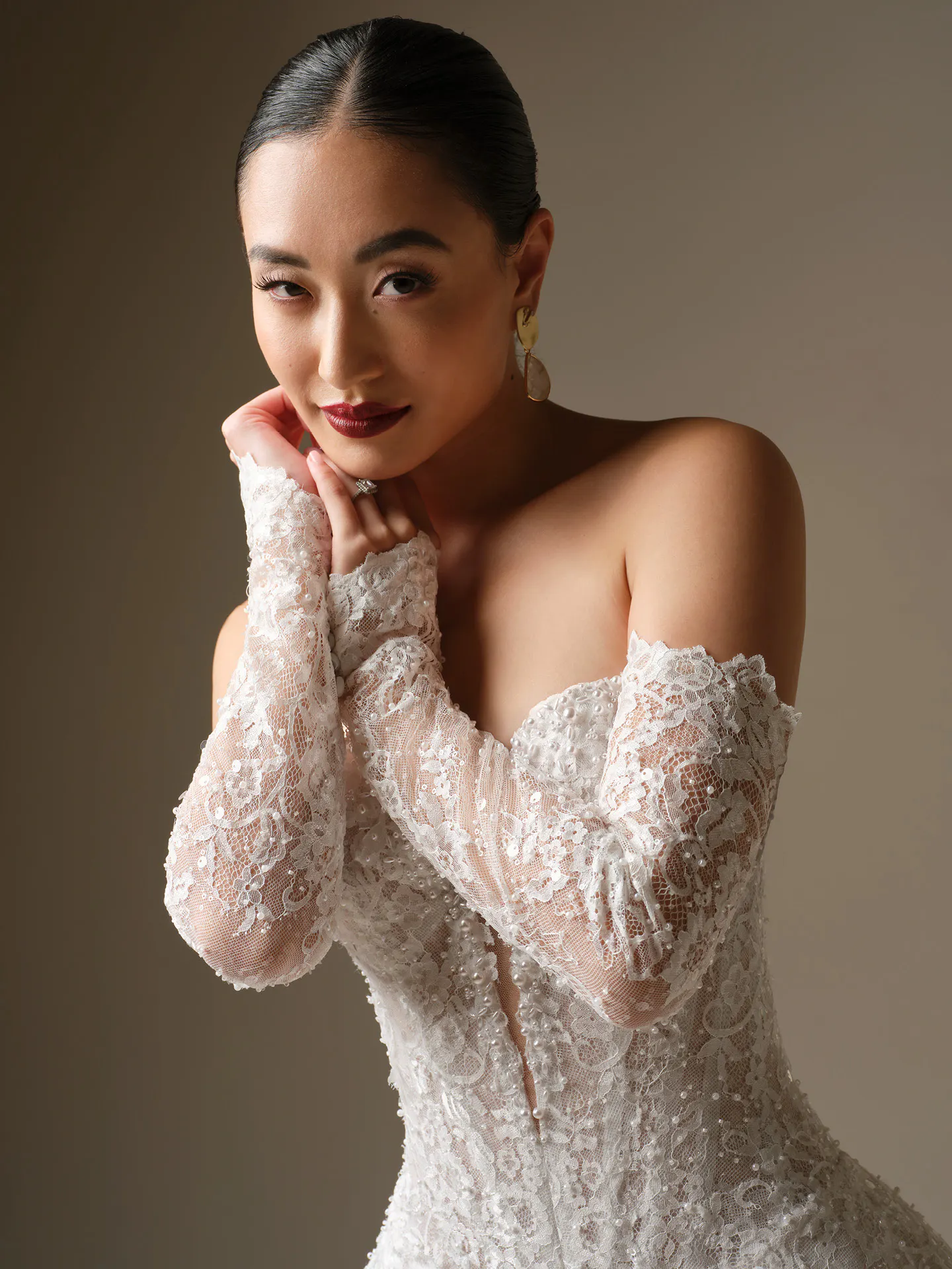 Maggie Sottero Angelica, front view, lace off-shoulder gown with beaded details.