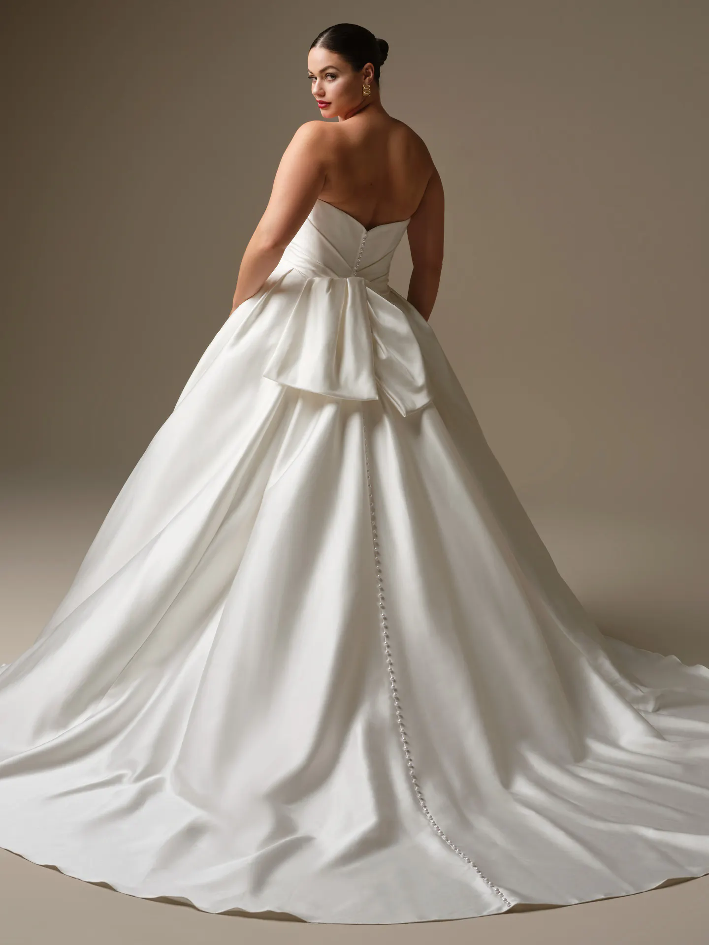 Sottero and Midgley Kincaid, back view satin ballgown with button detail.