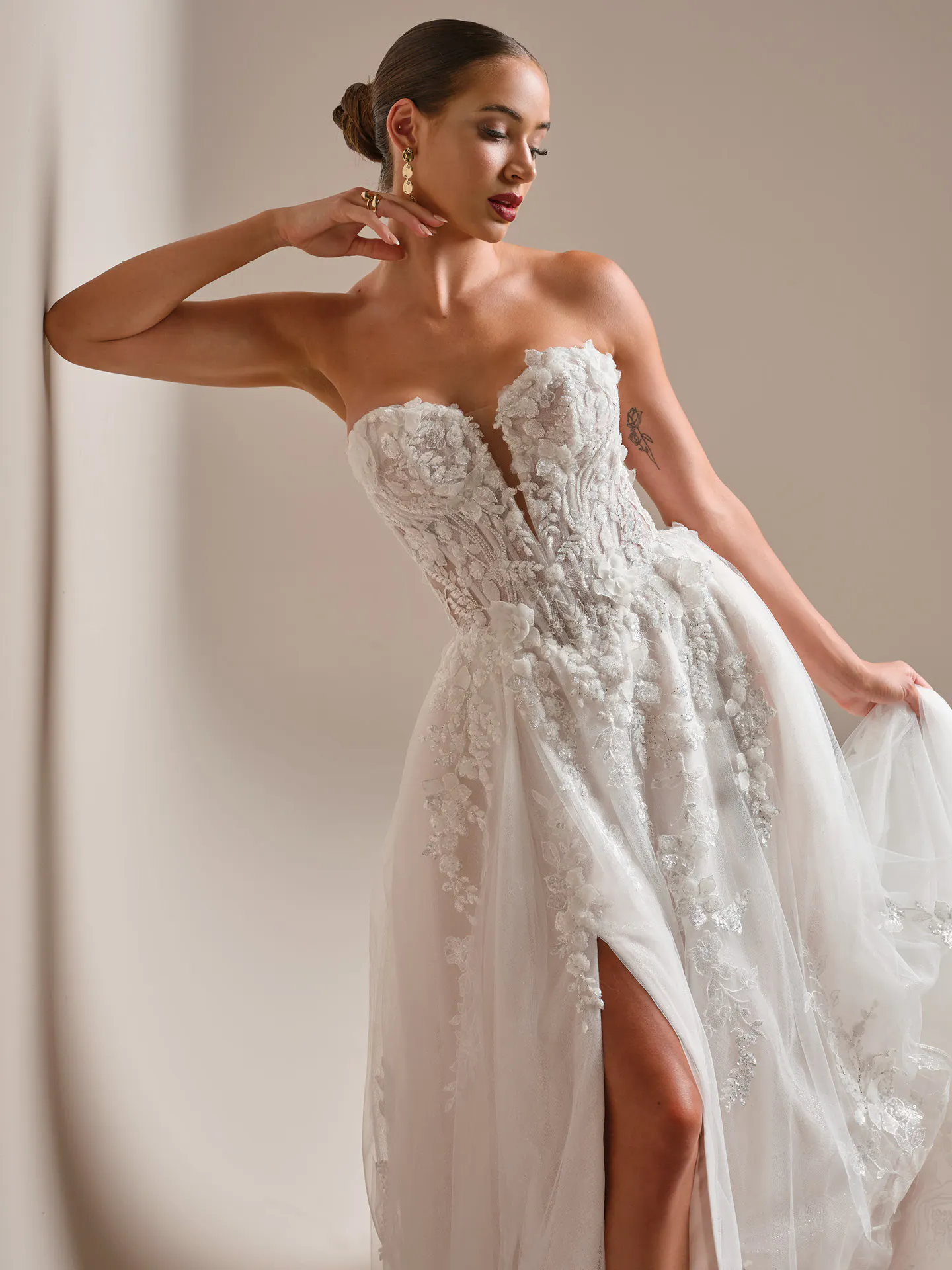 Sottero and Midgley 3-D beaded lace A-line wedding dress, side view.