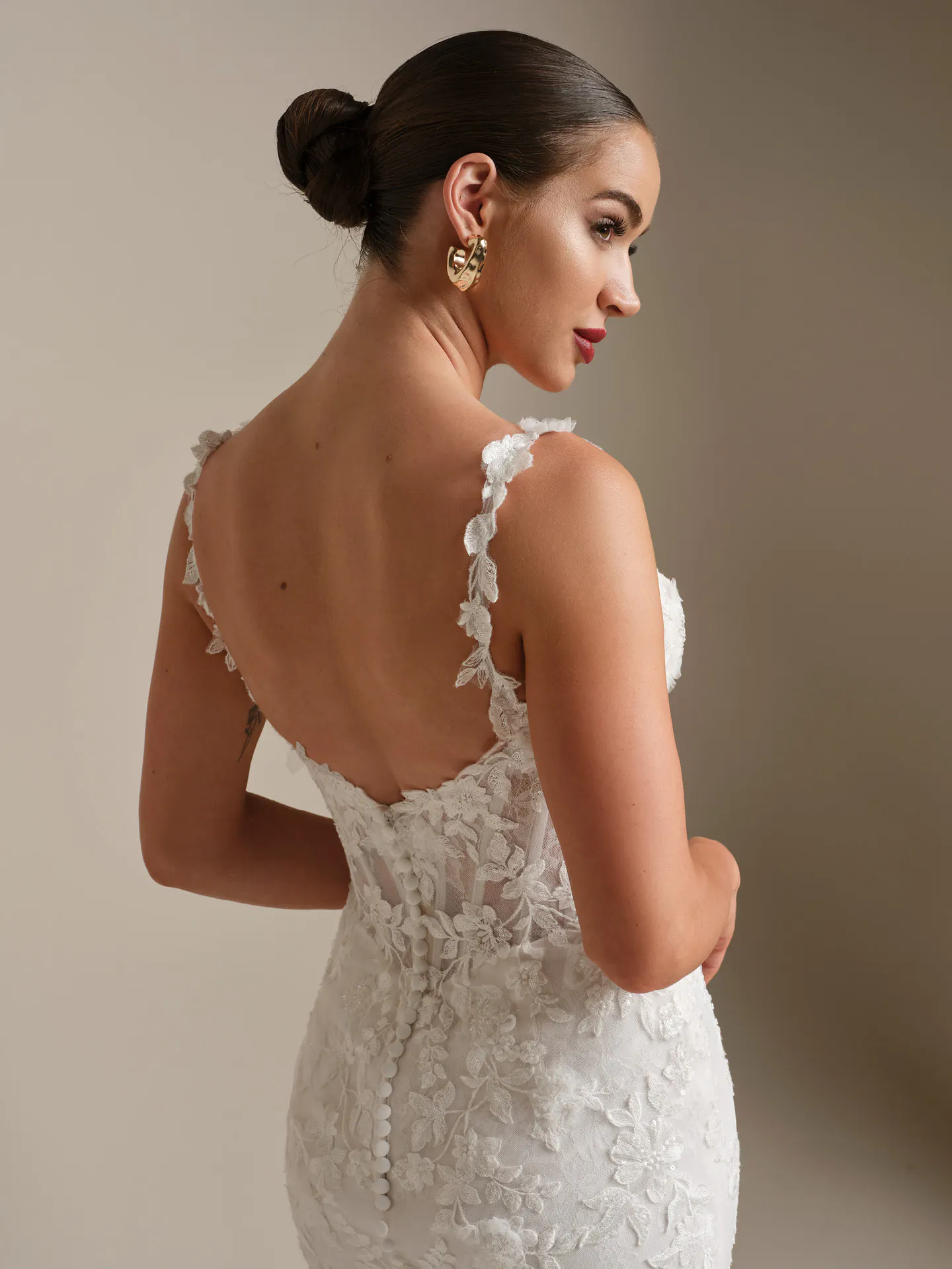Sottero and Midgley West, back view, floral lace fit-and-flare wedding dress.
