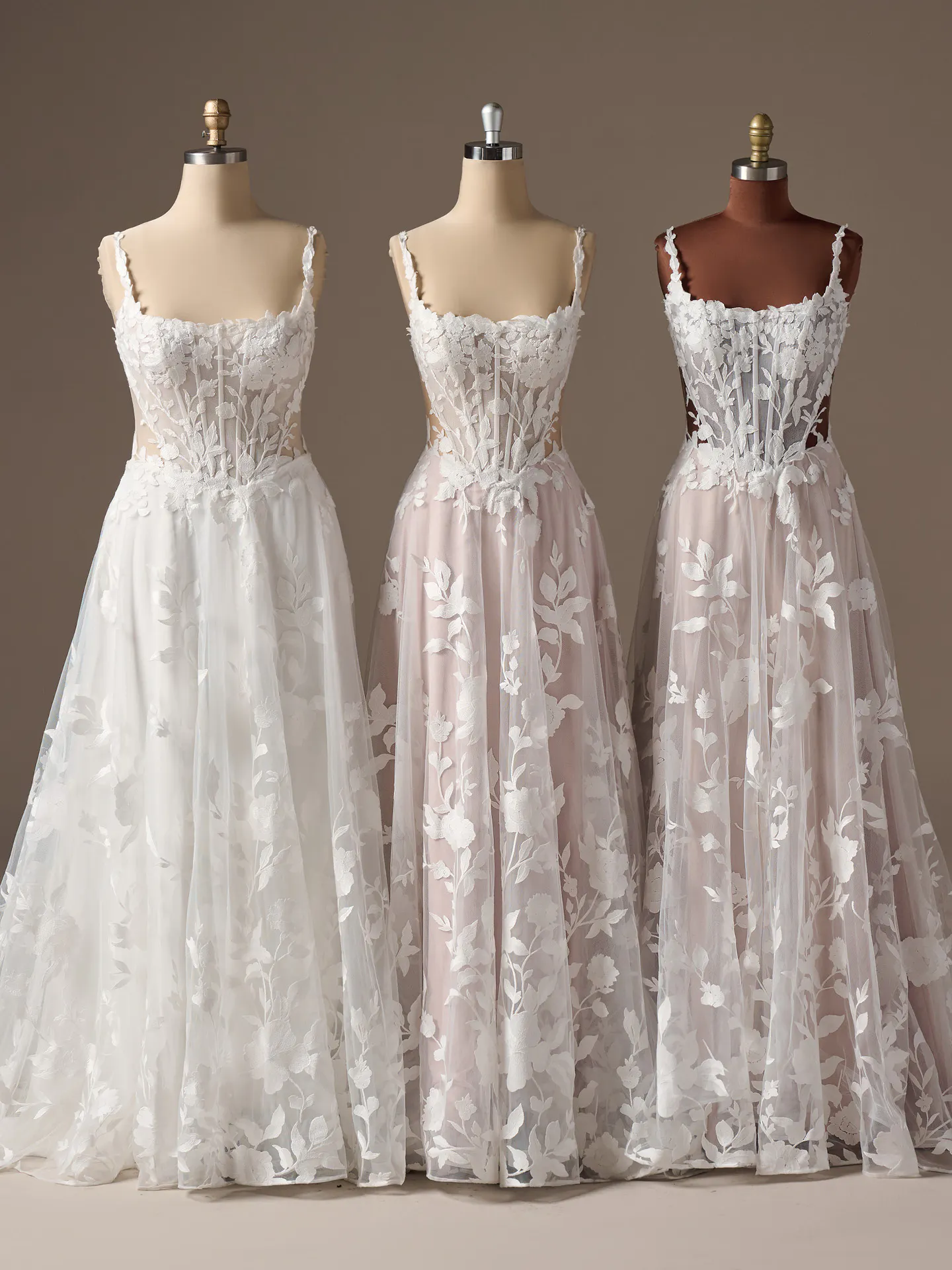 Maggie Sottero Natalie floral A-line dresses on mannequins, front view.