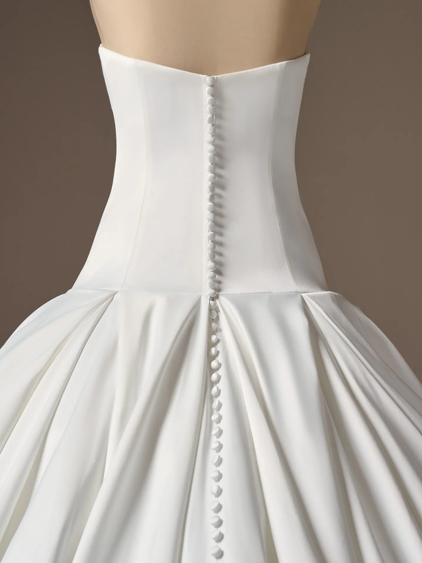 Maggie Sottero Adair, back view showing buttoned satin dropped waist ballgown by Sottero and Midgley.