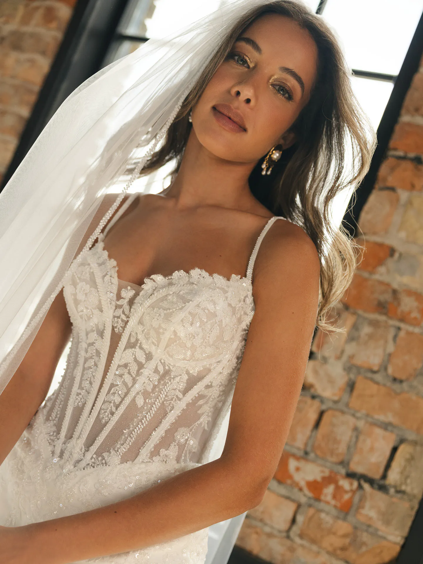 Maggie Sottero India beaded wedding dress, front view with veil.