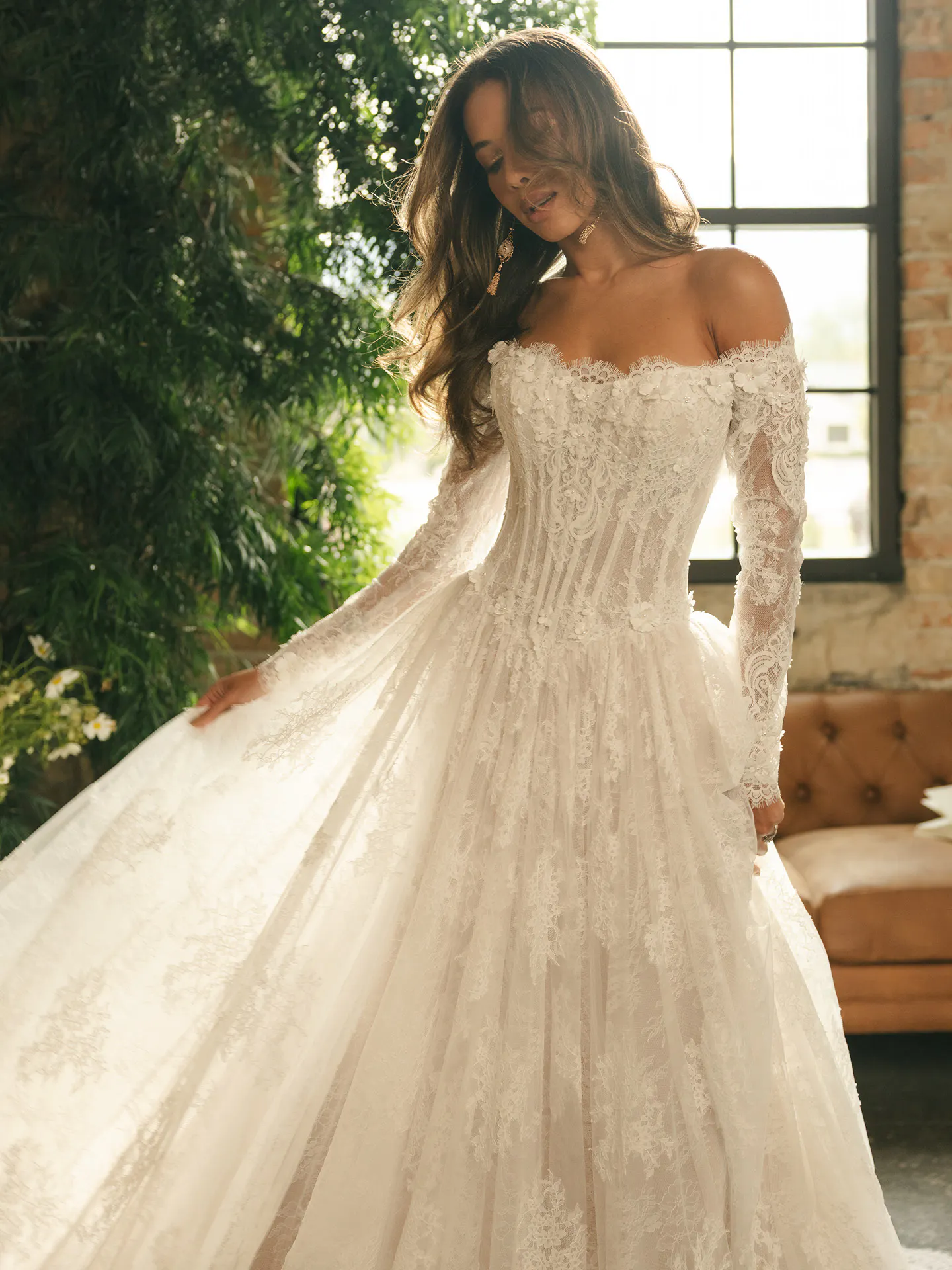 Maggie Sottero Kitaro, front view lace off-the-shoulder ballgown in elegant room.