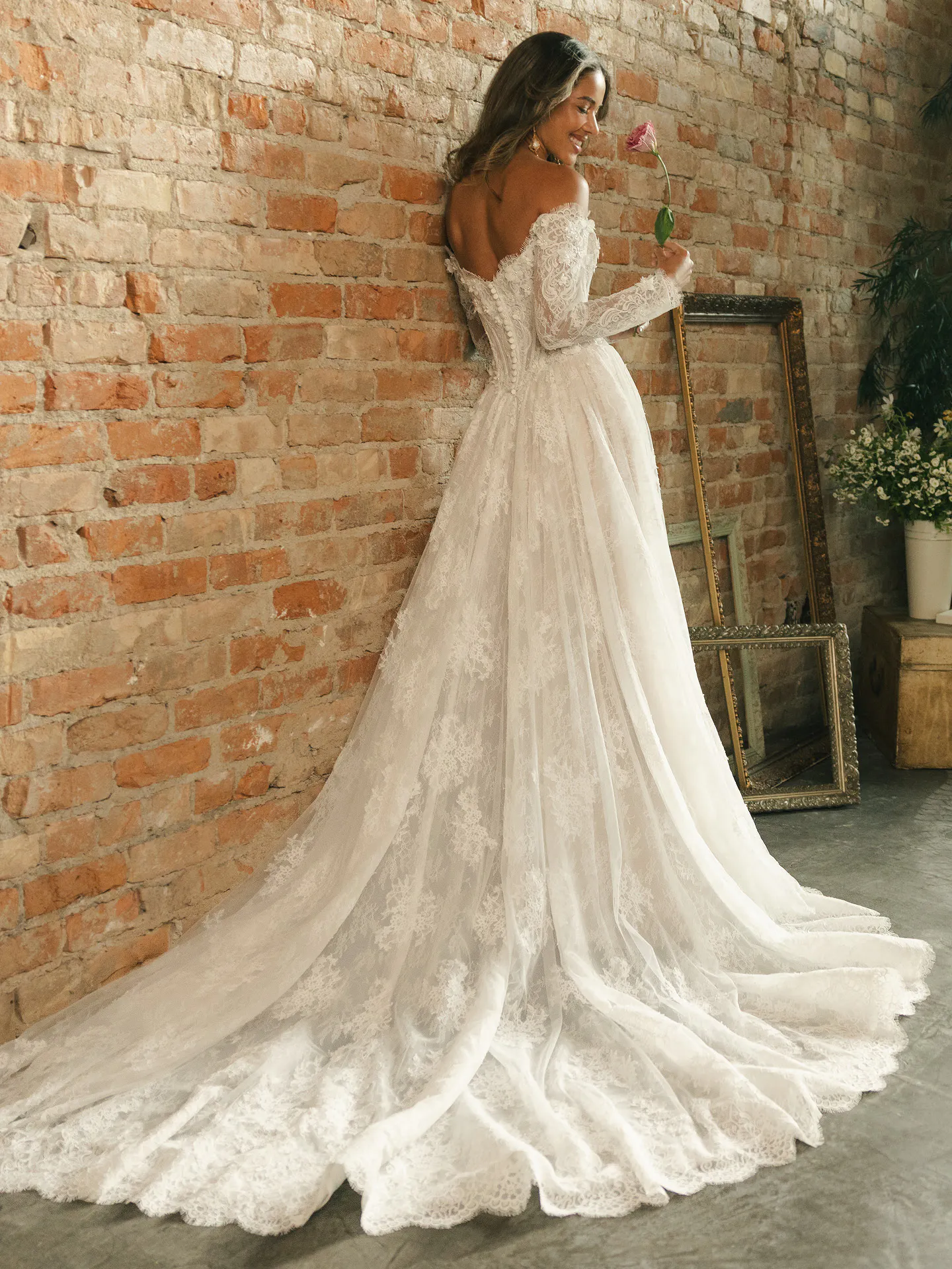 Maggie Sottero Kitaro off-the-shoulder lace ballgown, back view.