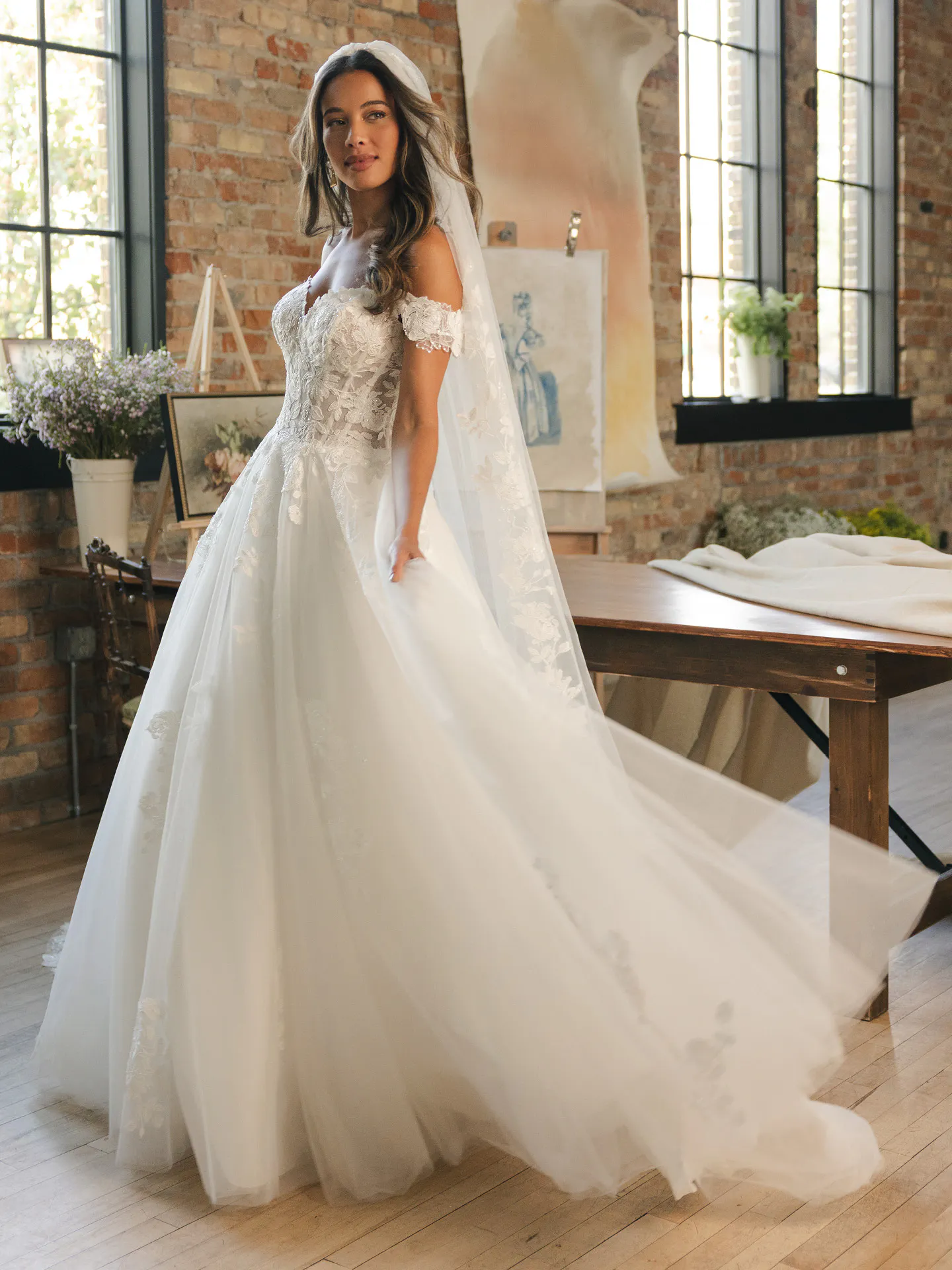 Maggie Sottero Verina off-shoulder lace A-line wedding dress front view Maggie Sottero.