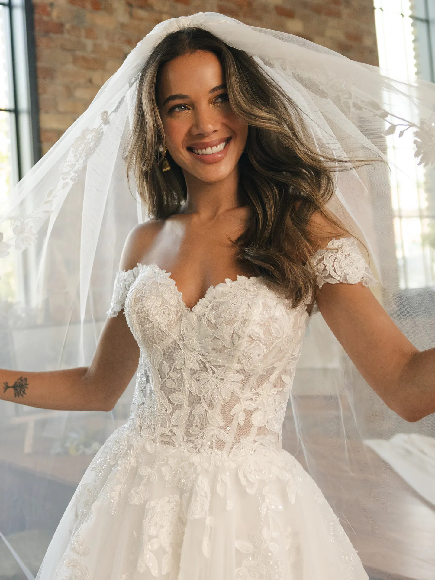 Maggie Sottero Verina, front view lace off-shoulder A-line wedding dress.