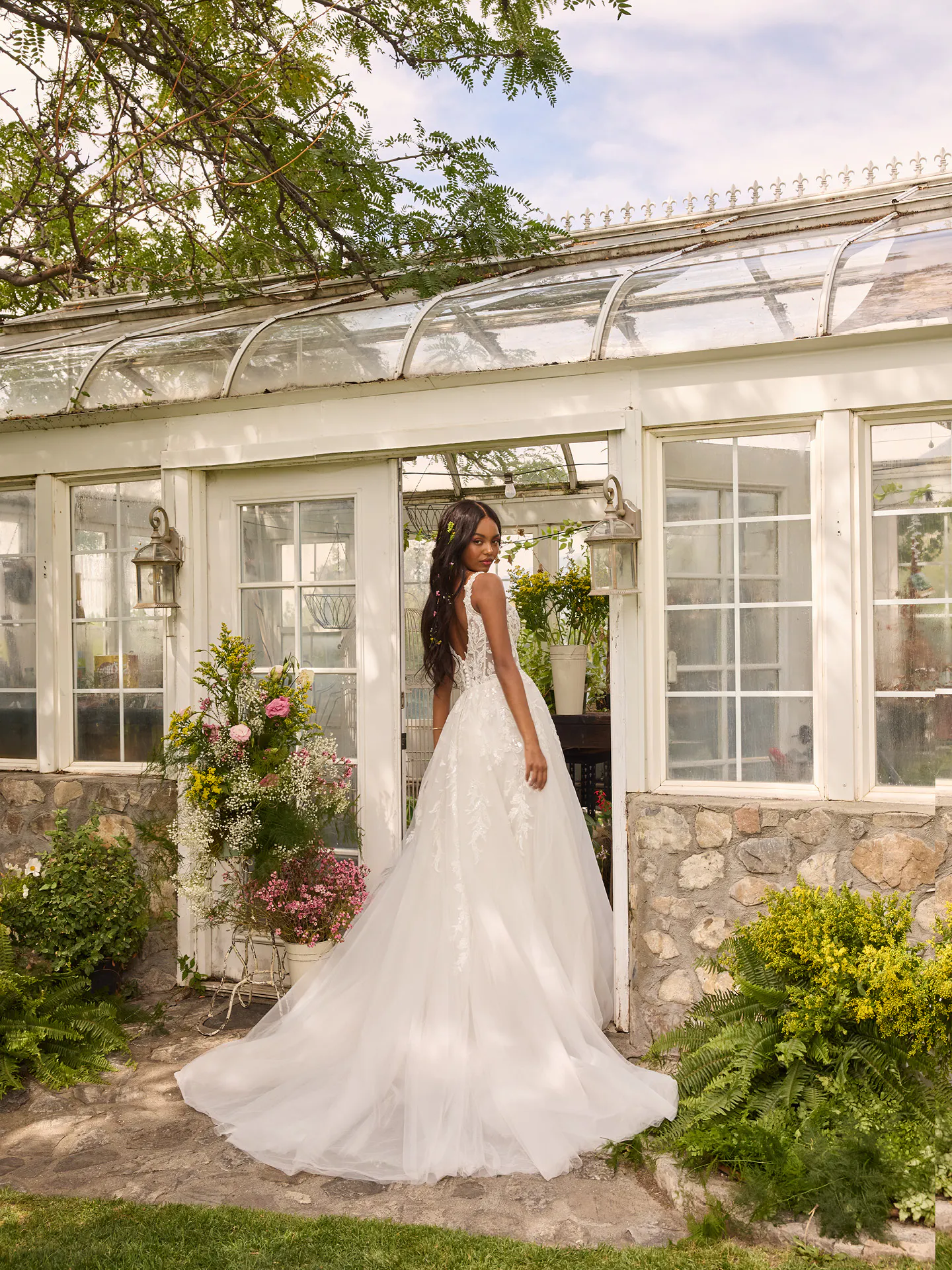 Rebecca Ingram Susan back view ballgown wedding dress near garden conservatory