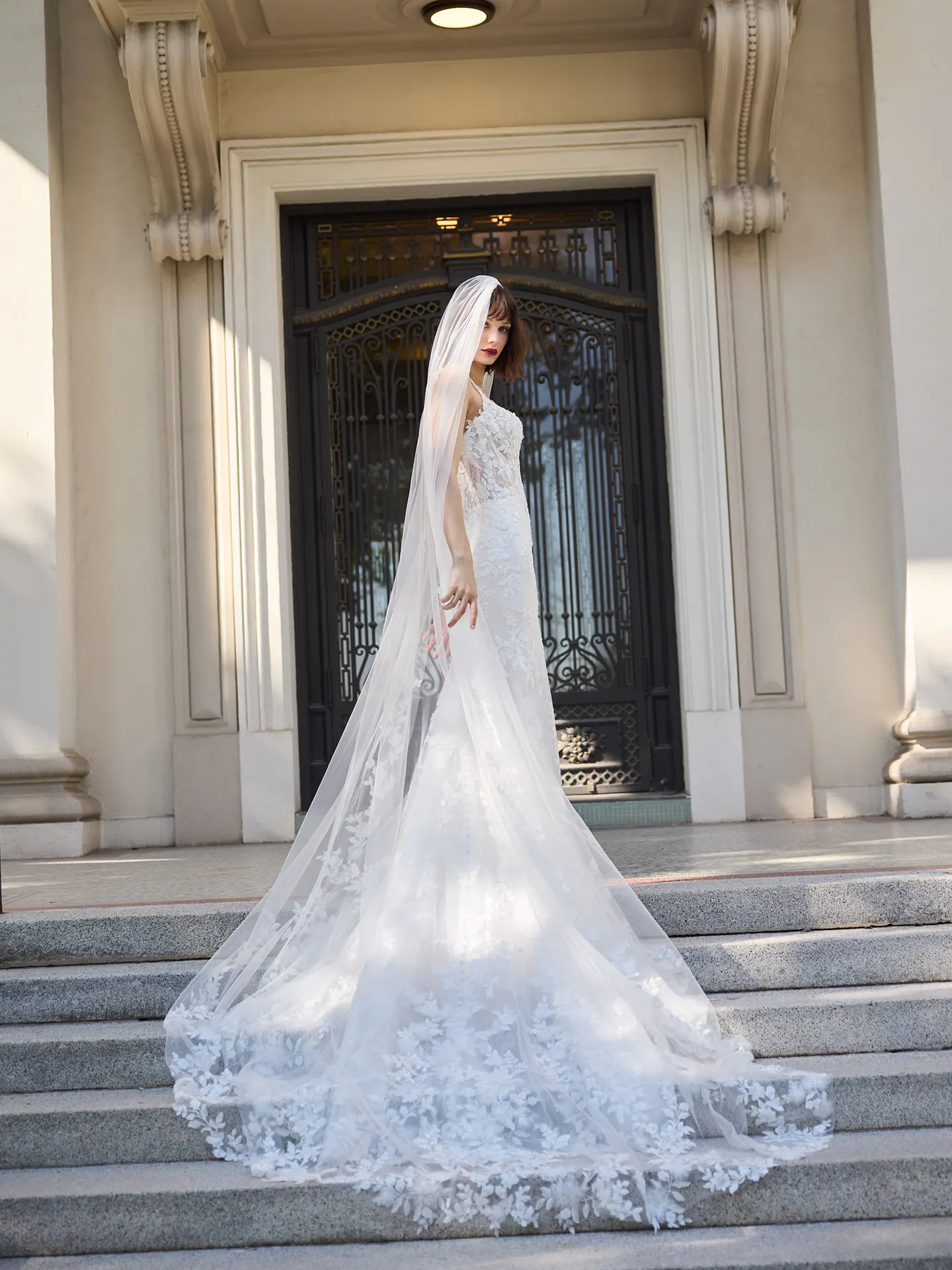 Sottero and Midgley West, side view, beaded lace fit-and-flare dress with long veil.