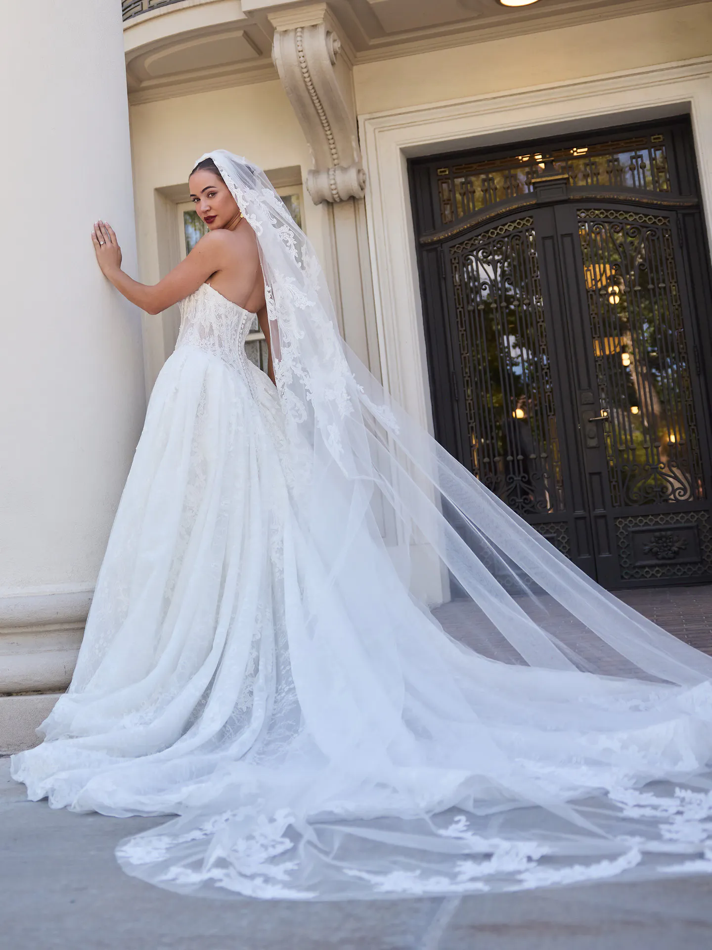 Sottero and Midgley Zulani ballgown wedding dress with long trailing skirt and veil