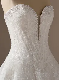 Maggie Sottero Angelica, side view; beaded lace A-line wedding dress.