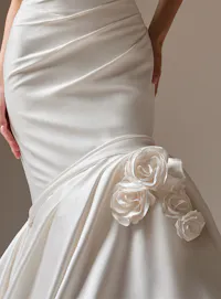 Maggie Sottero Emelina close-up with floral details satin fit-and-flare dress.