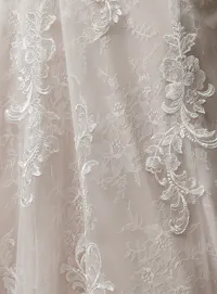 Lace detail of Maggie Sottero Farrah A-Line wedding dress with floral pattern.