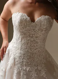 Maggie Sottero Jennifer A-Line wedding dress closeup with floral lace detailing.