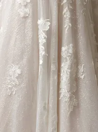 Jennifer A-Line sequin wedding dress close-up by Maggie Sottero, floral lace details.