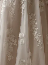 Maggie Sottero Jennifer V-Neck A-Line with floral sequin embroidery detail.