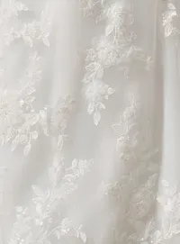 Sottero and Midgley West beaded lace fit-and-flare wedding dress close-up detail.
