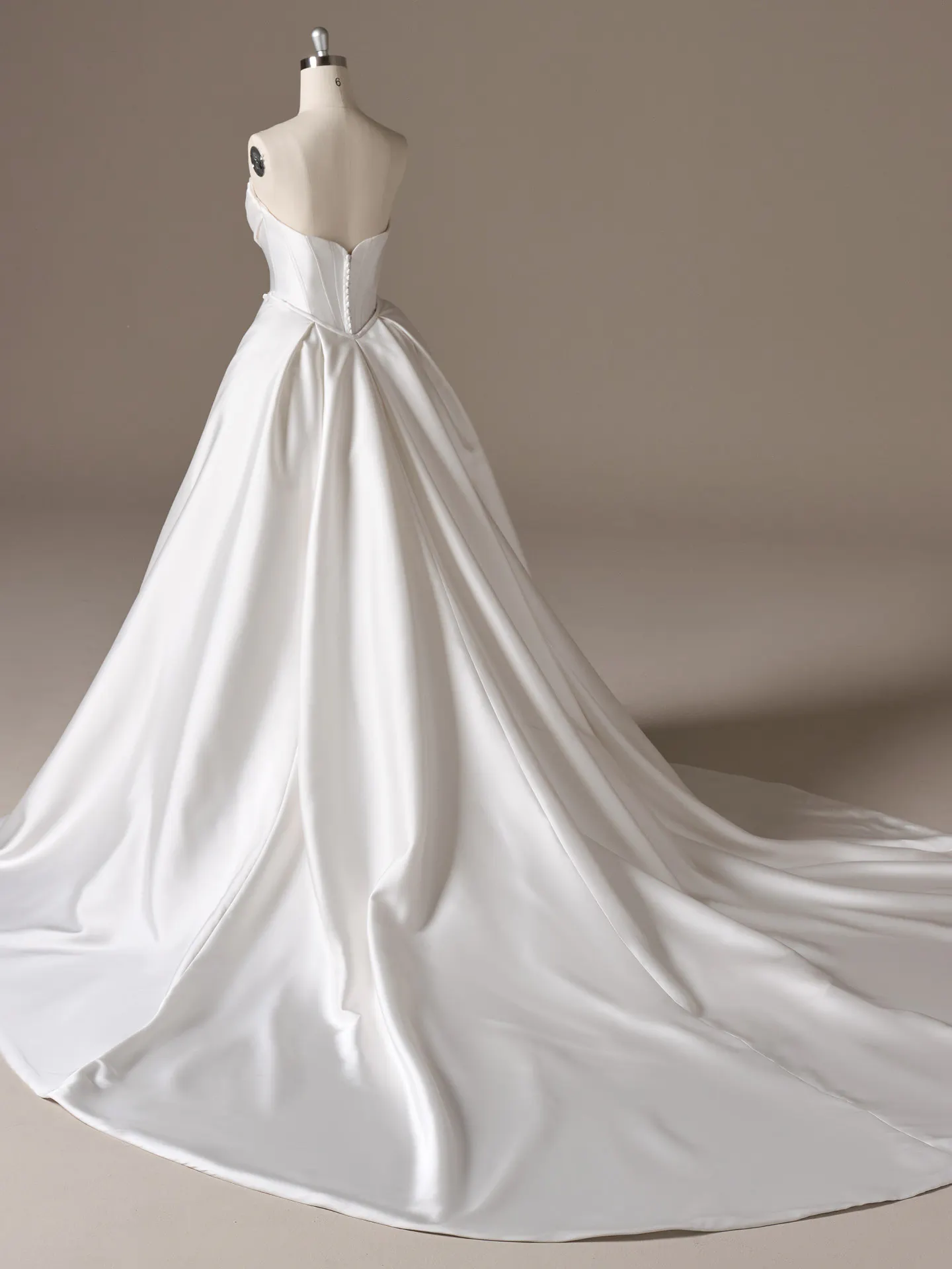 Maggie Sottero Melissa fit and flare wedding dress side view with defined waist