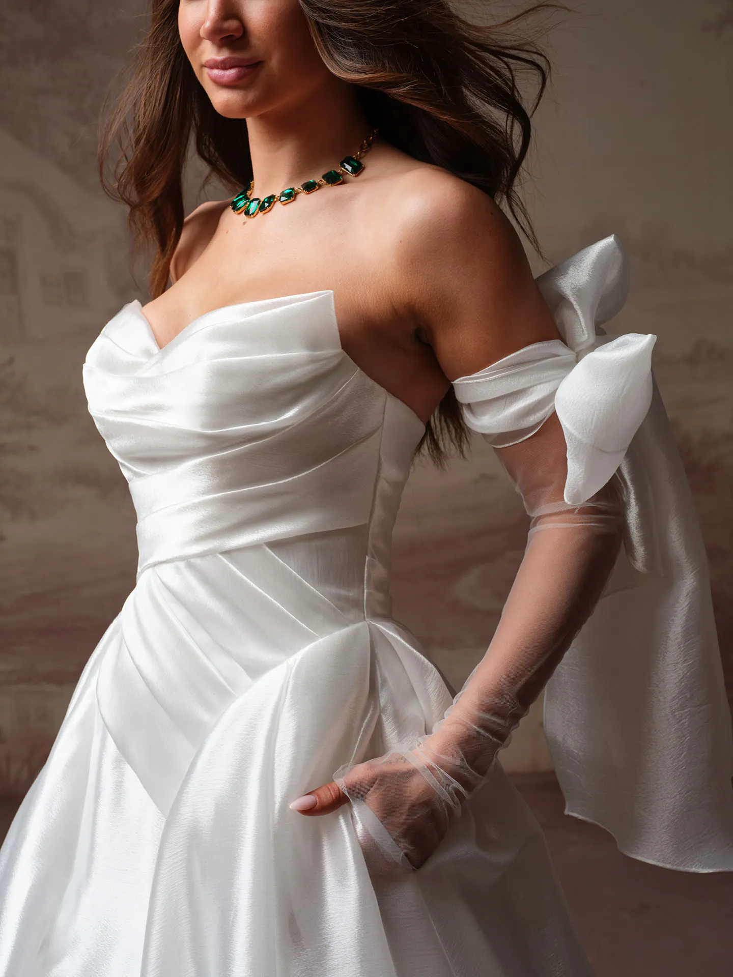 Maggie Sottero Paris side view, tulle sleeves with bows, fitted bodice.