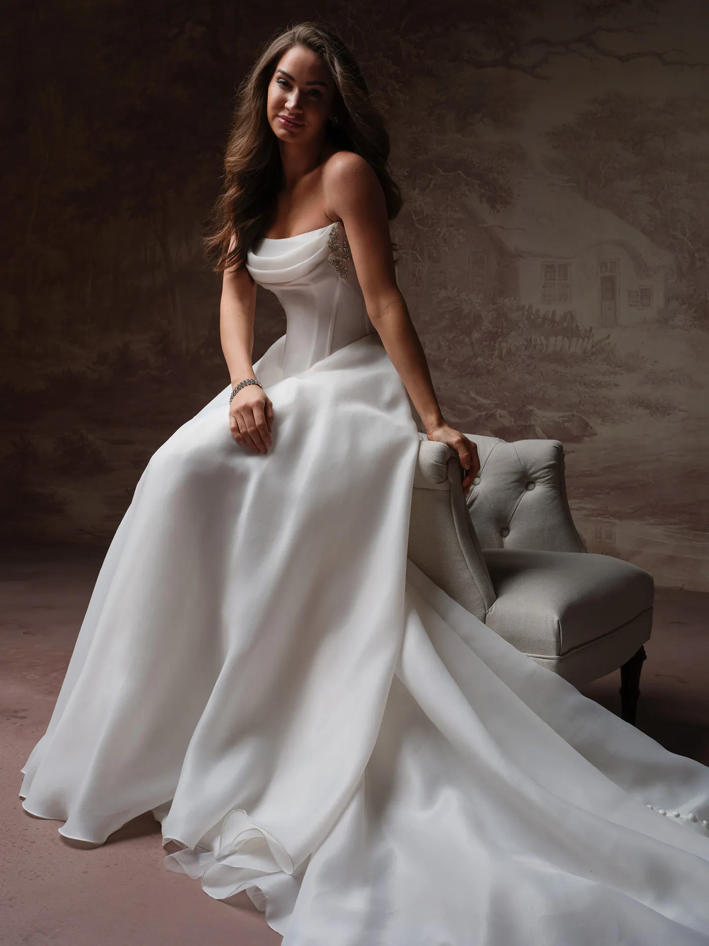 Maggie Sottero Abilene front view sitting A-line organza dress.
