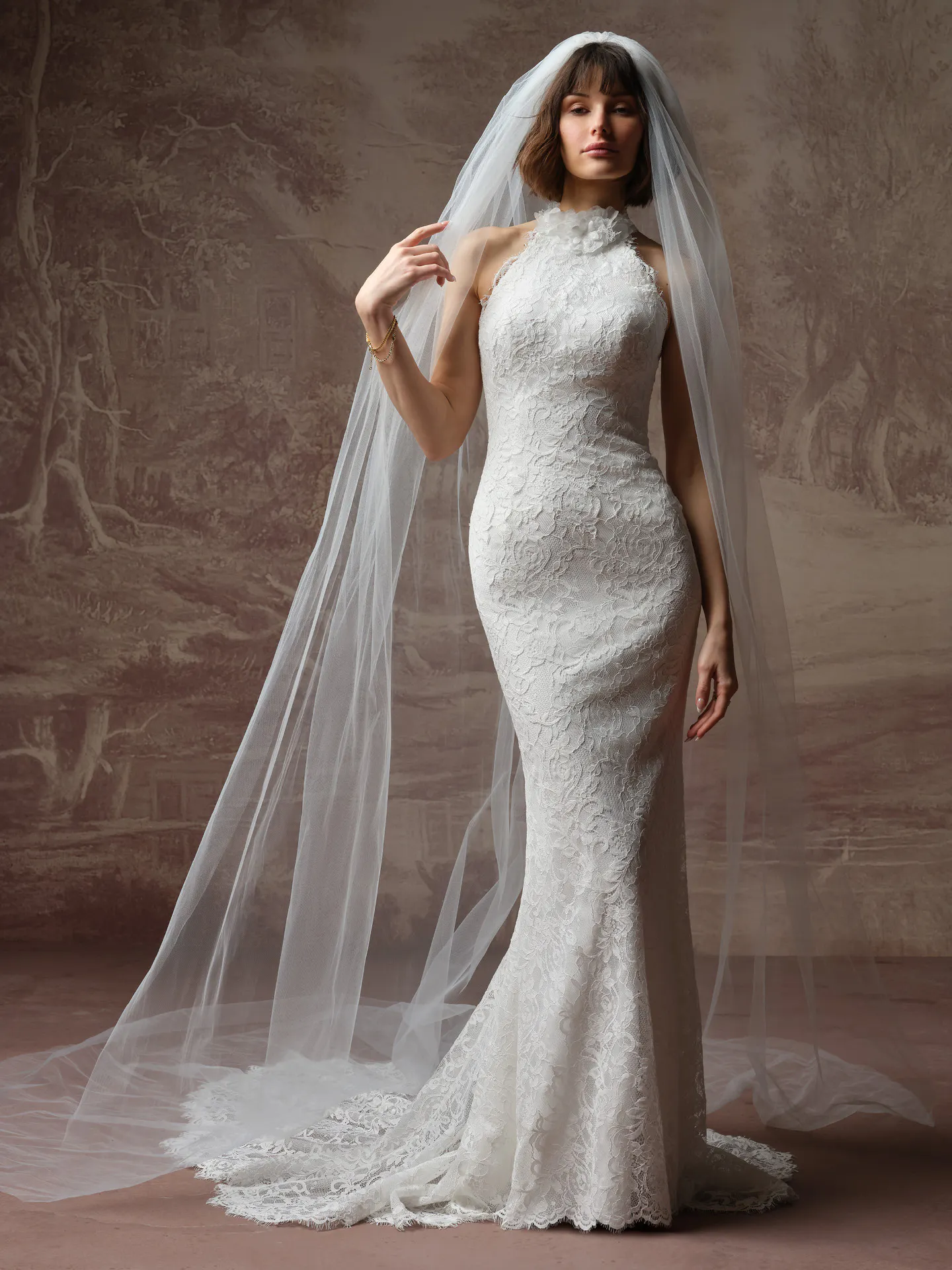 Maggie Sottero Anya front view lace high neck sheath dress with long veil.