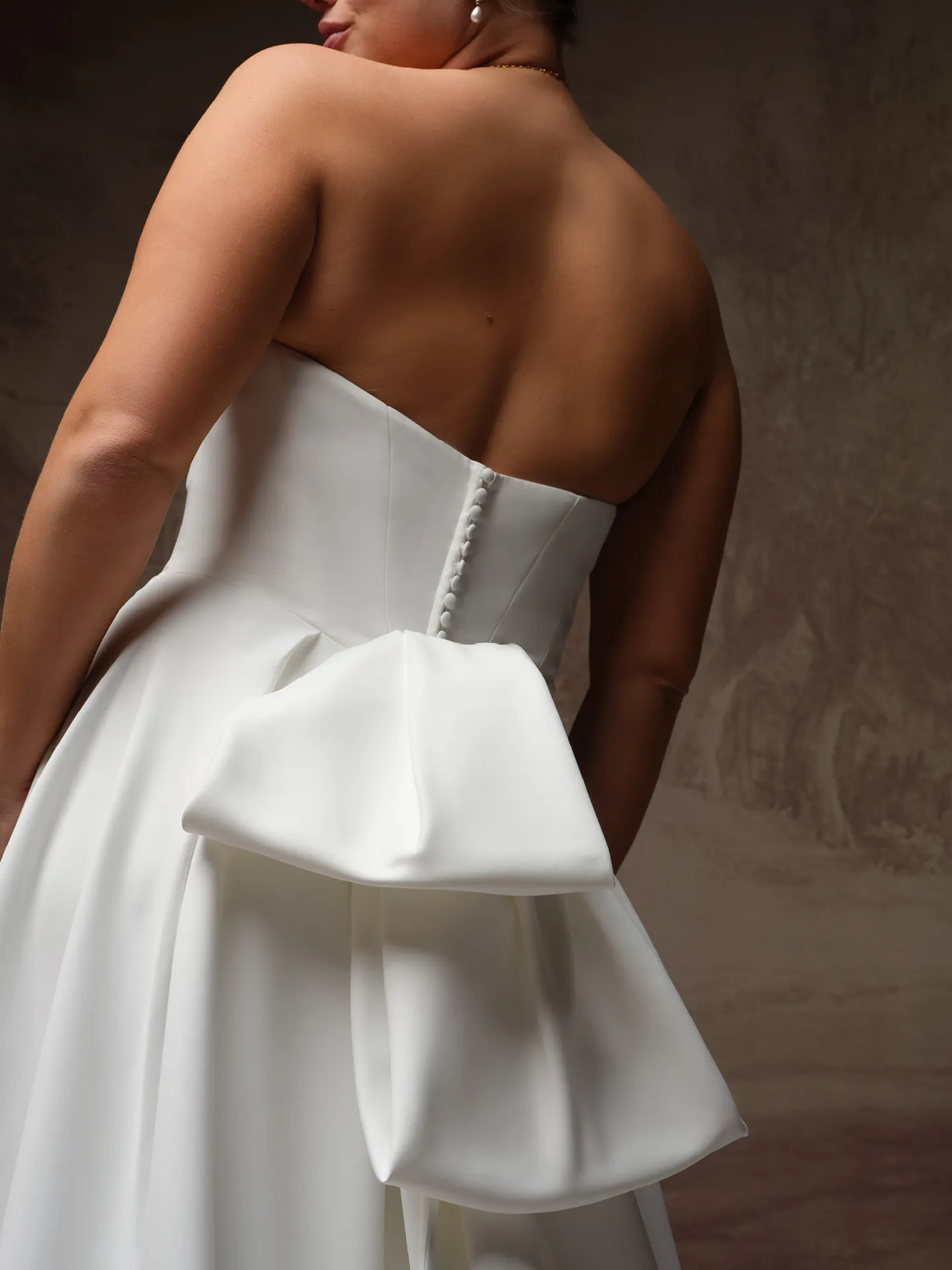 Maggie Sottero Calliope detachable bow, front view.