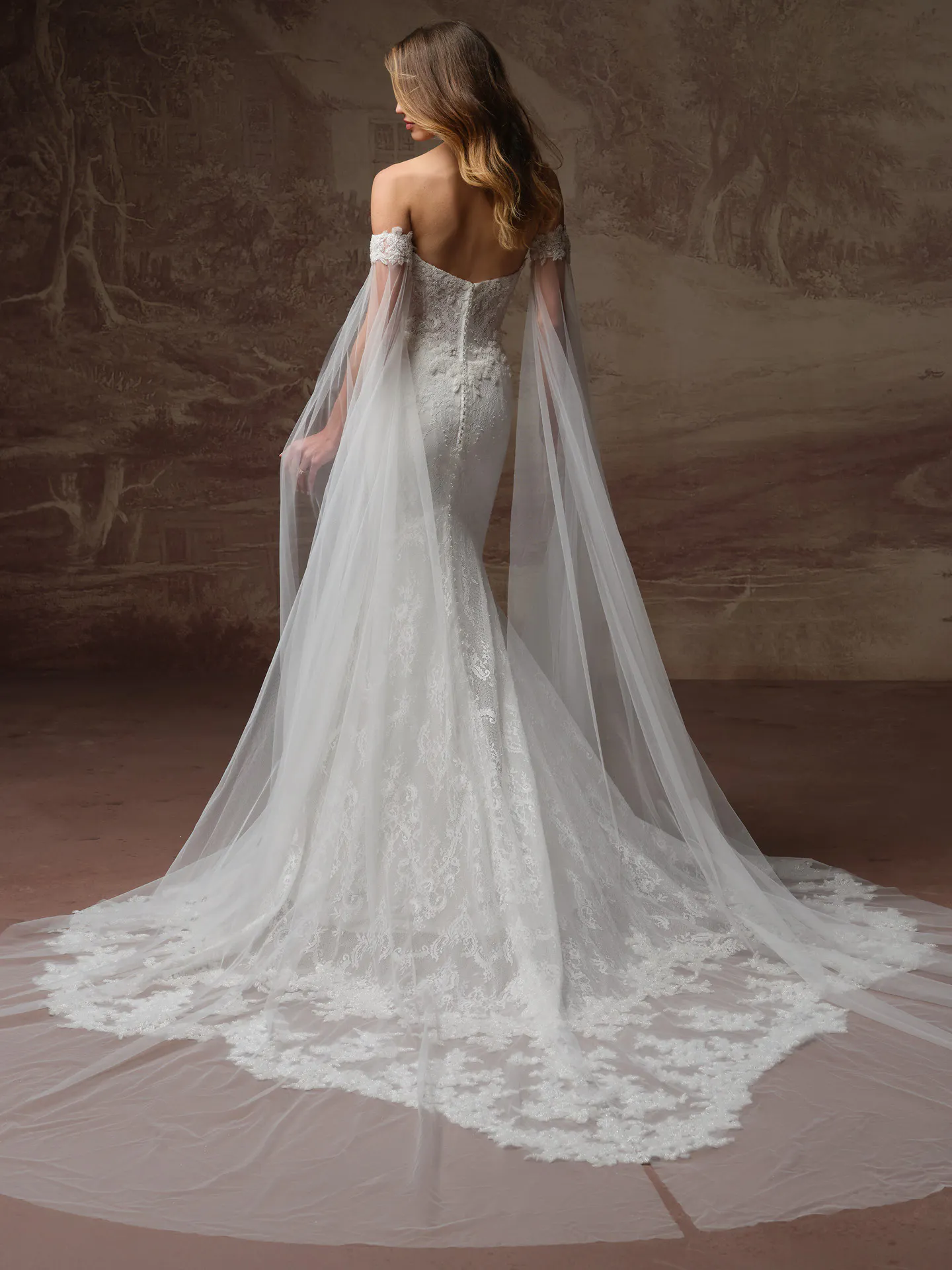 Maggie Sottero Collette back view beaded Chantilly lace wedding dress with long veil sleeves.