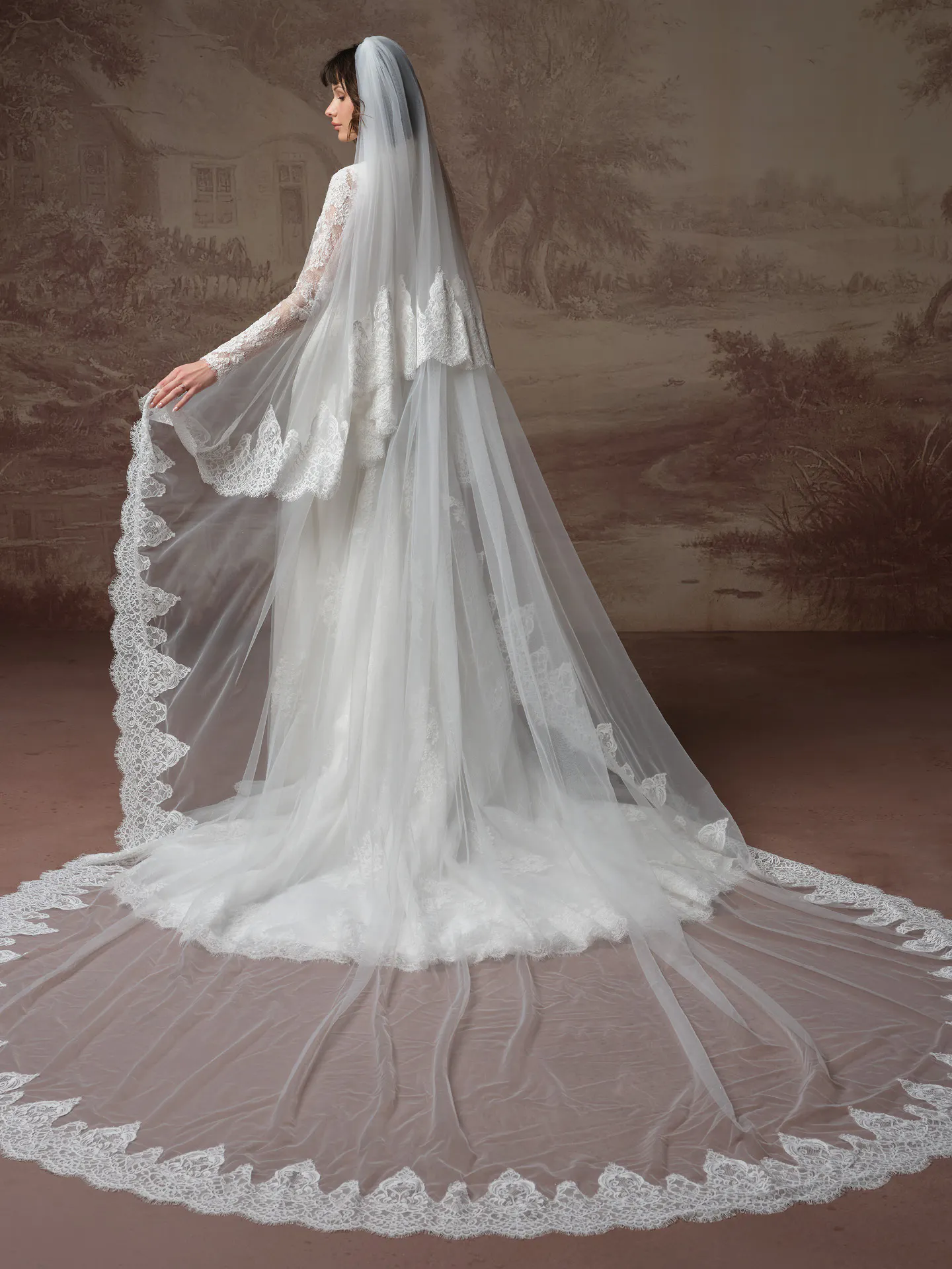 Dominique lace wedding dress back view with long veil Maggie Sottero.