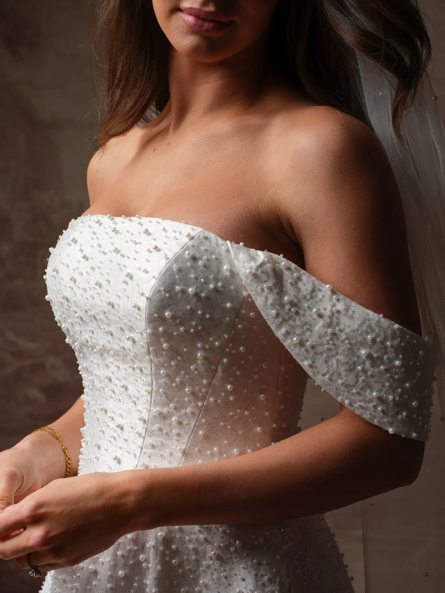 Elowyn beaded straight neckline wedding dress close up, off-shoulder detail.