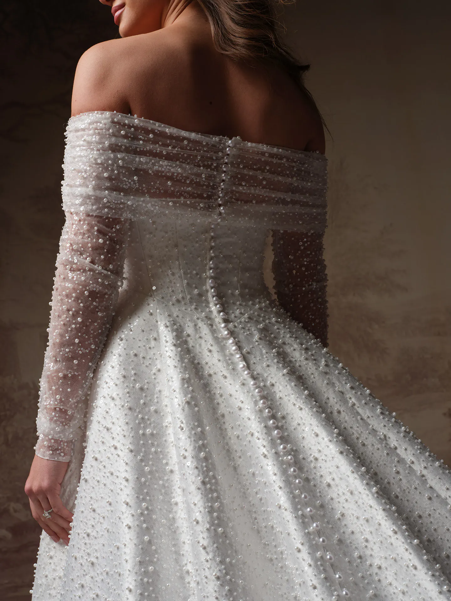 Maggie Sottero Elowyn back view, beaded off-shoulder wedding dress with straight neckline.
