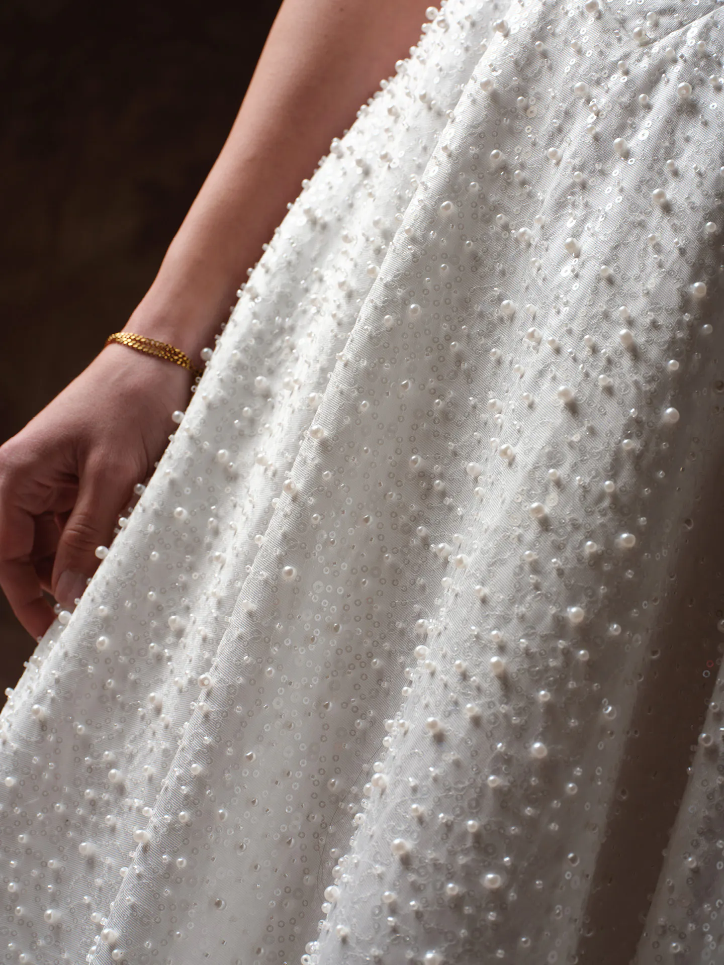 Elowyn beaded texture detail on Maggie Sottero wedding dress.