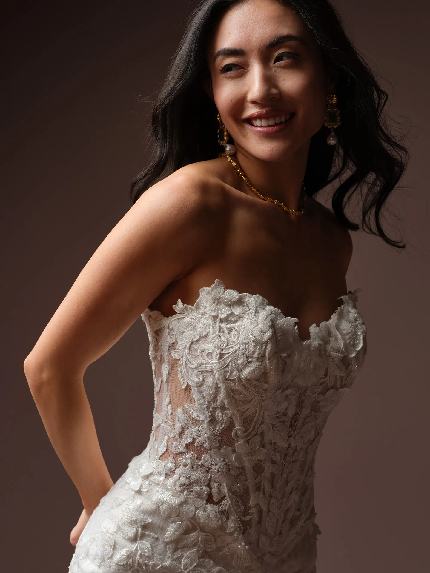 Maggie Sottero Estelle side view, beaded lace wedding dress with floral design.