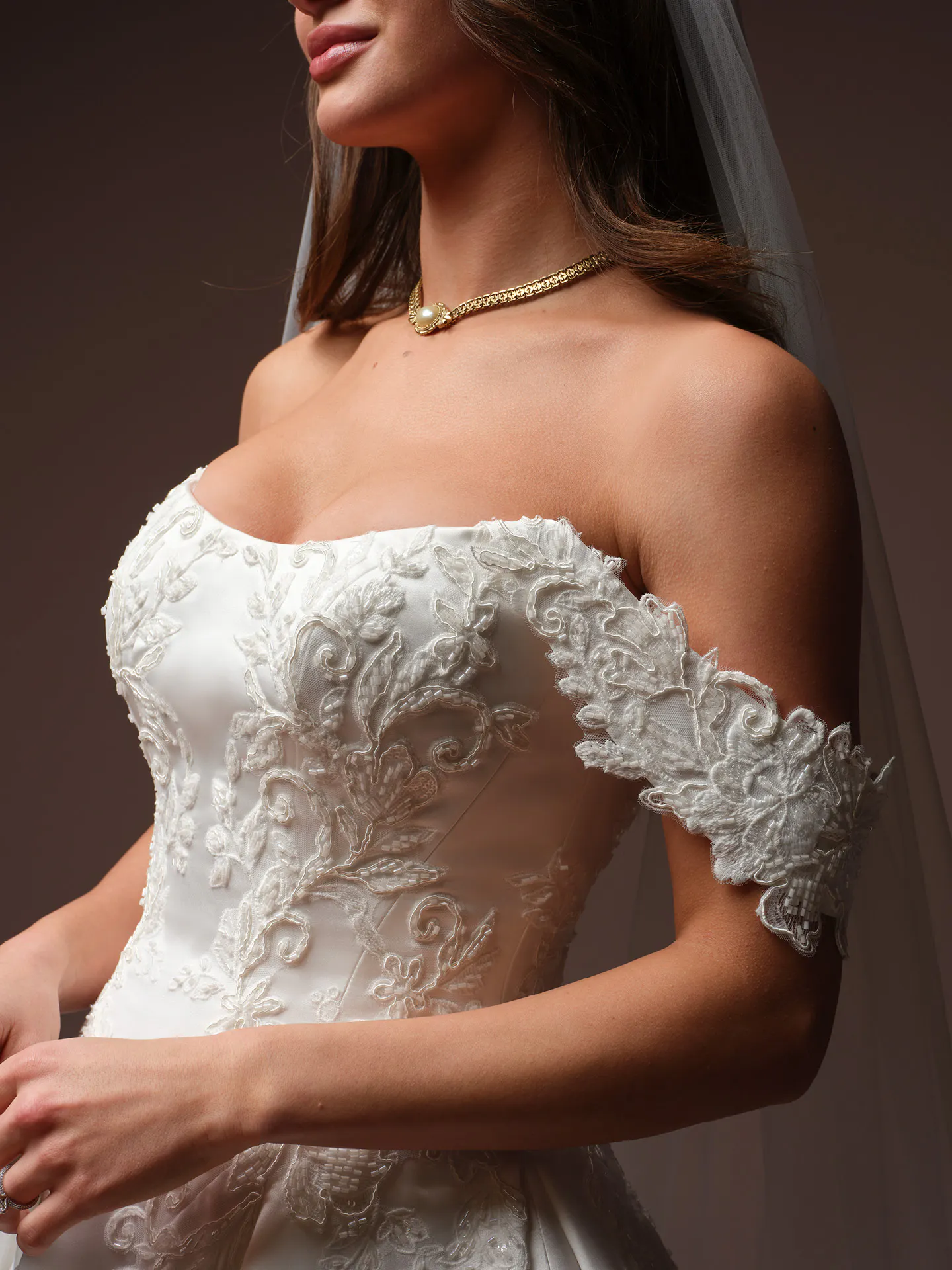 Maggie Sottero Landis front view lace satin ballgown off-shoulder wedding dress.
