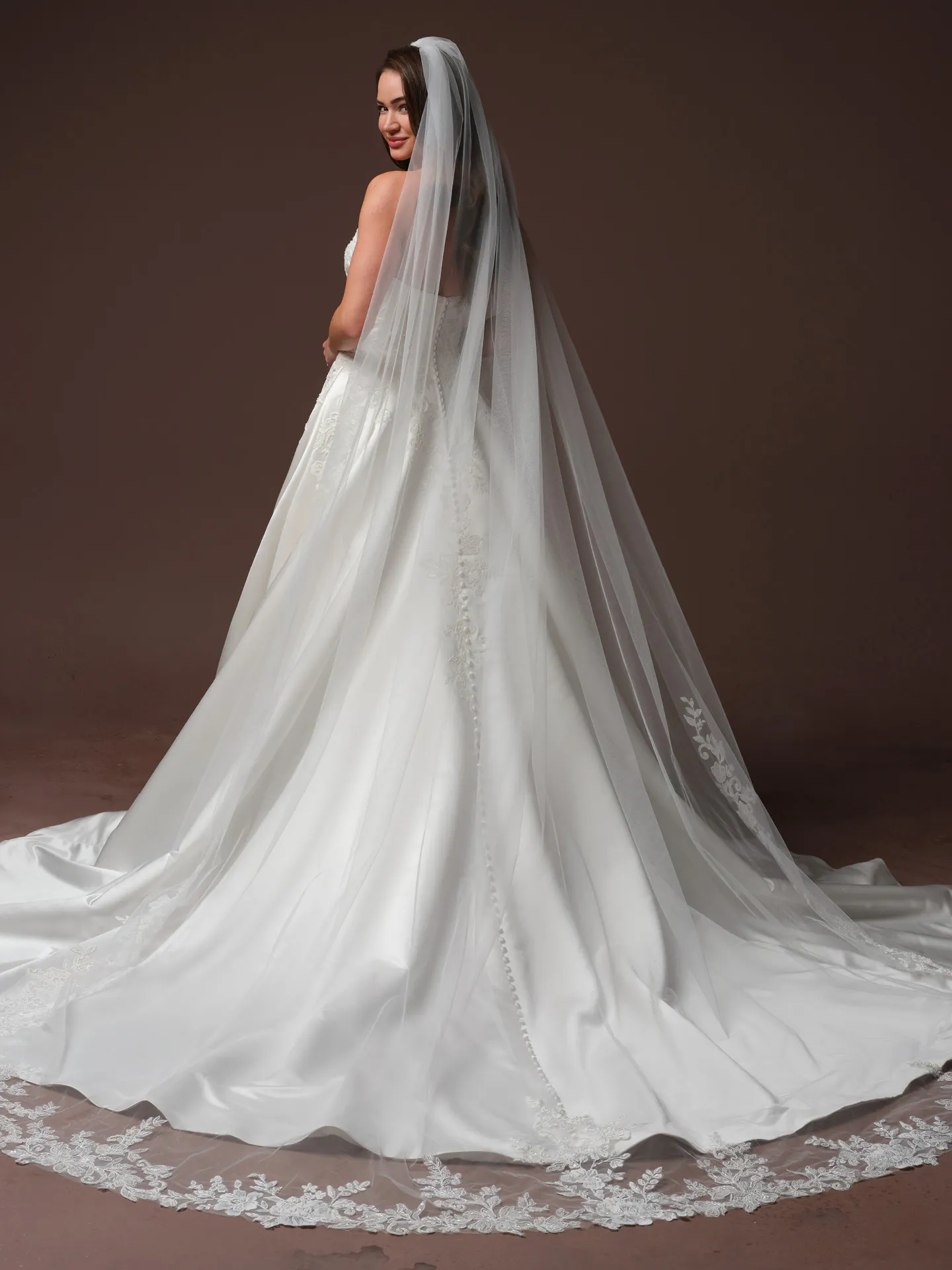 Maggie Sottero Landis back view sequin lace satin ballgown wedding dress with long veil.
