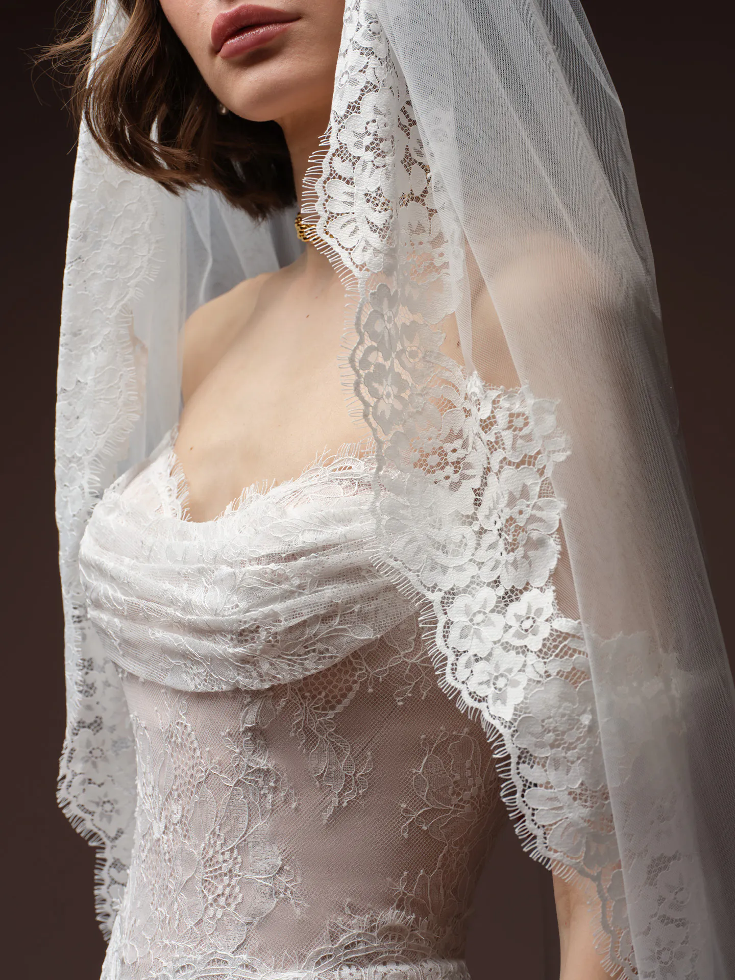 Maggie Sottero Maelle lace bodice close up with veil detailing.