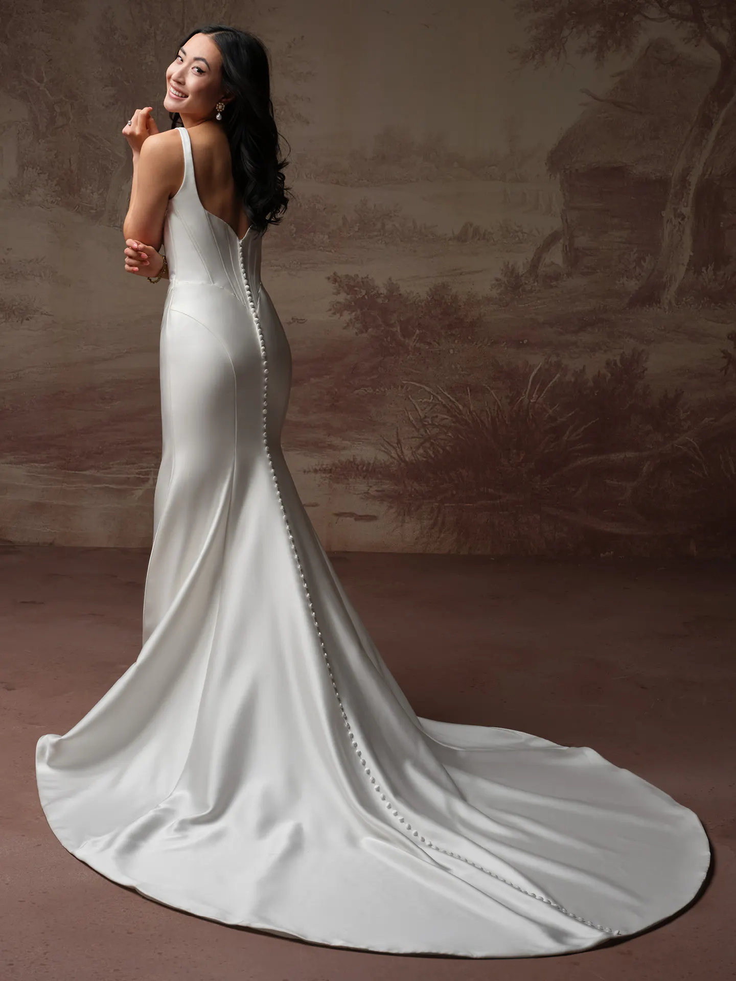 Maggie Sottero Melissa back view satin mermaid bridal dress with pearl buttons.