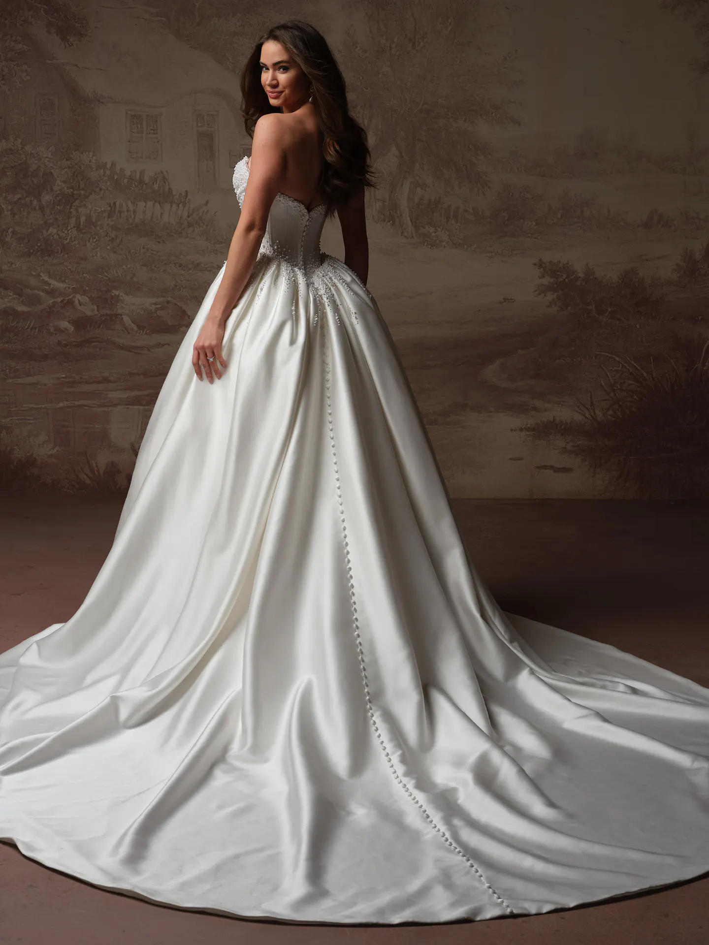 Maggie Sottero Melissa back view satin mermaid wedding dress with button detail.